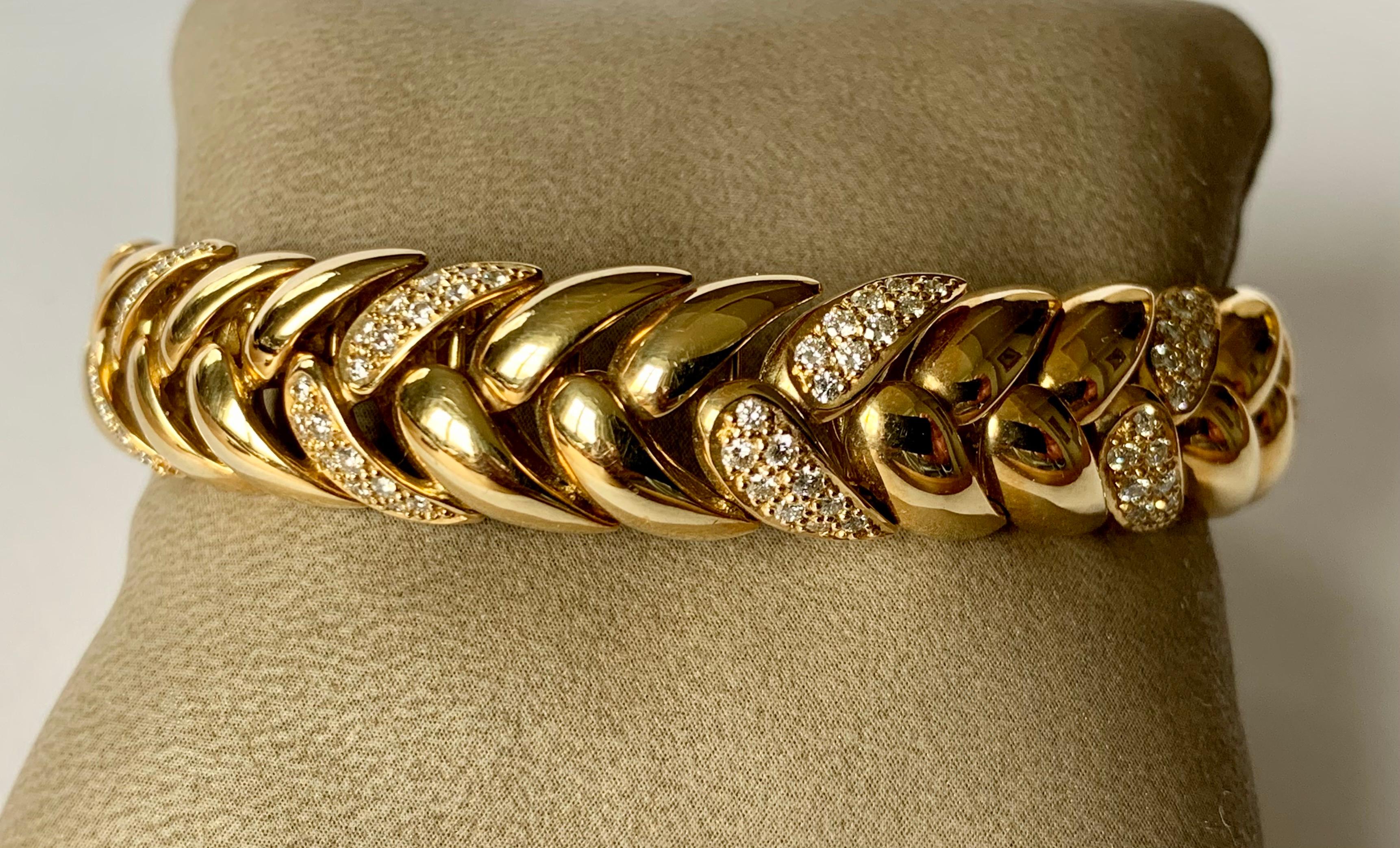 By Swiss designer Gübelin, this 18 K yellow Gold bracelet  with a classic and timeless design is set with 182 brilliant cut Diamonds weighing approximately 2 ct, G color, vs clarity. The length is 19 cm the width is 1.2 cm and the bracelet weighs