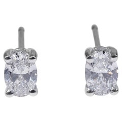 Classic 18 Kt. White Gold Stud Oval Earrings, 0.60 Ct Diamond, GIA Certificate