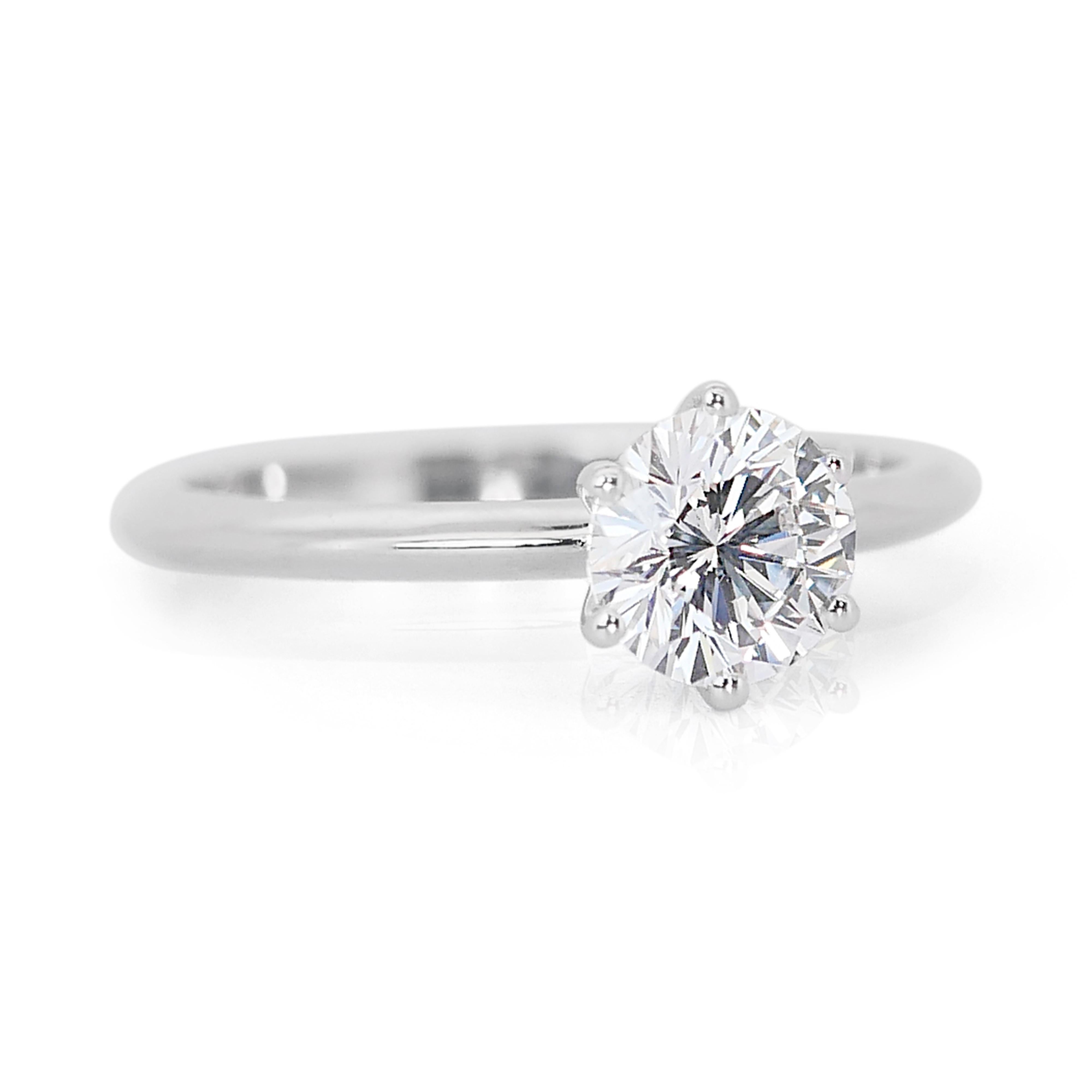 Classic 18k White Gold Diamond Solitaire Ring w/0.54 ct - GIA Certified

This classic 18k white gold solitaire ring is the epitome of timeless elegance, featuring a single round diamond that radiates pure sophistication. The centerpiece, with a 0.54