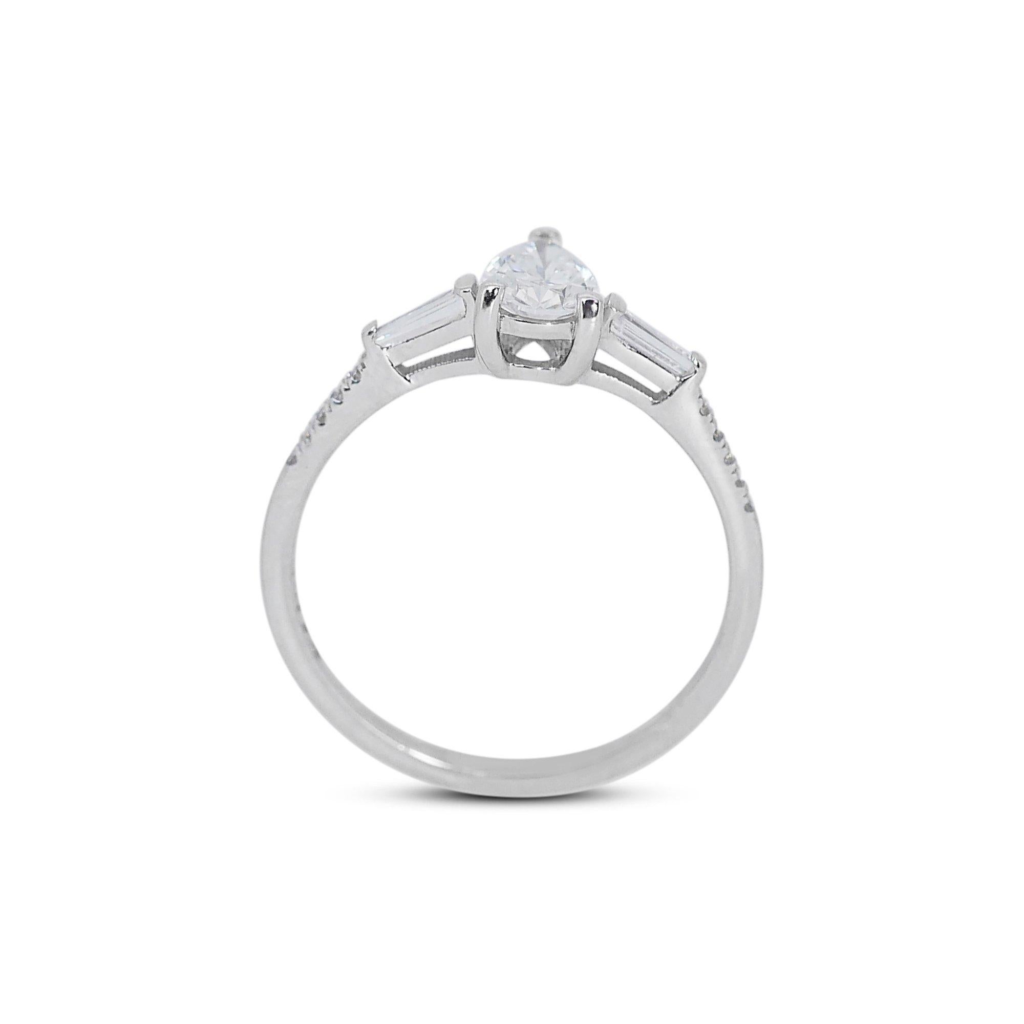 Classic 18k White Gold Natural Diamond Solitaire Ring w/0.93 ct - GIA Certified

Featuring this mesmerizing diamond solitaire ring that embodies timeless beauty and classic design. With a mesmerizing 0.70 carat pear-shaped diamond center stone,