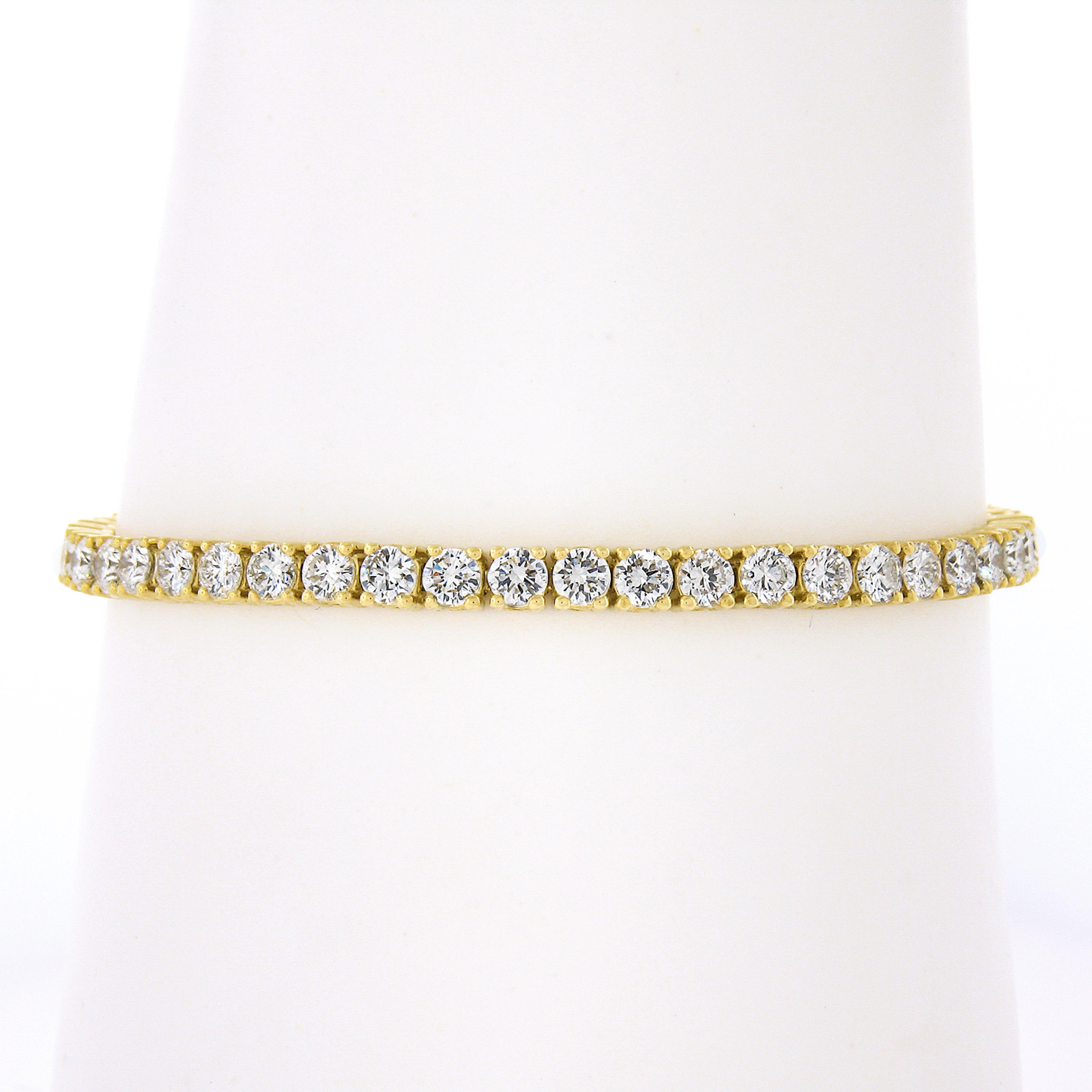 This classic line tennis bracelet is crafted in solid 18k yellow gold and features 50 fine quality diamonds. These stunning round brilliant cut diamonds weigh approximately 7.50ctw and sit neatly in their prong settings. This is a very well made and