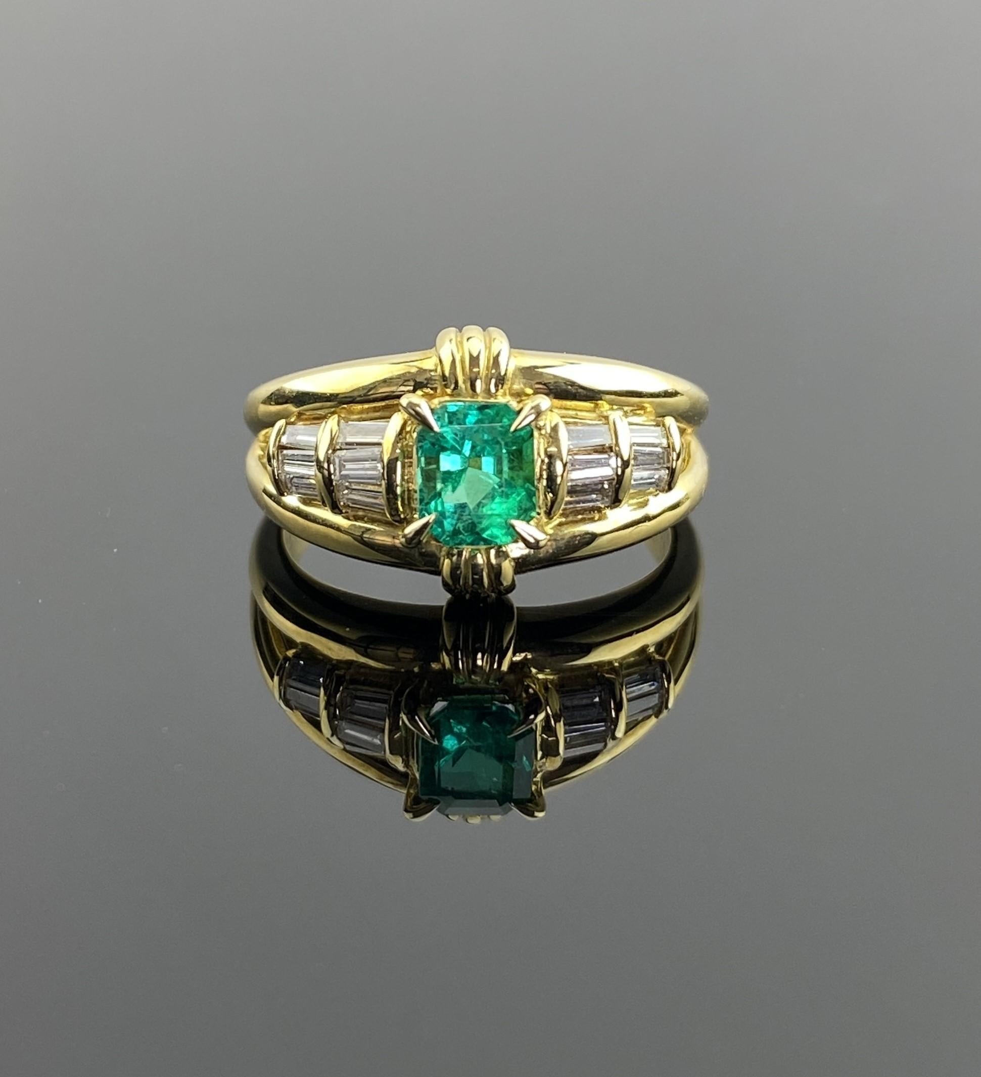 The centerpiece of this ring is a vibrant 0.54-carat emerald from Colombia, renowned for producing some of the finest emeralds in the world. This square-cut emerald boasts a rich green hue, expertly set to enhance its natural brilliance.
 
Flanking