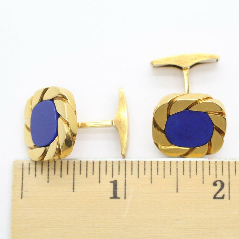 Timeless heirlooms that will last for generations to come. Classic 18k yellow gold cuff links with lapis lazuli centers. Sugarloaf closures. Made in Germany.
Specifications:
    main stone:  lapis lazuli 
    carat total weight:-
    color:BLUE
   