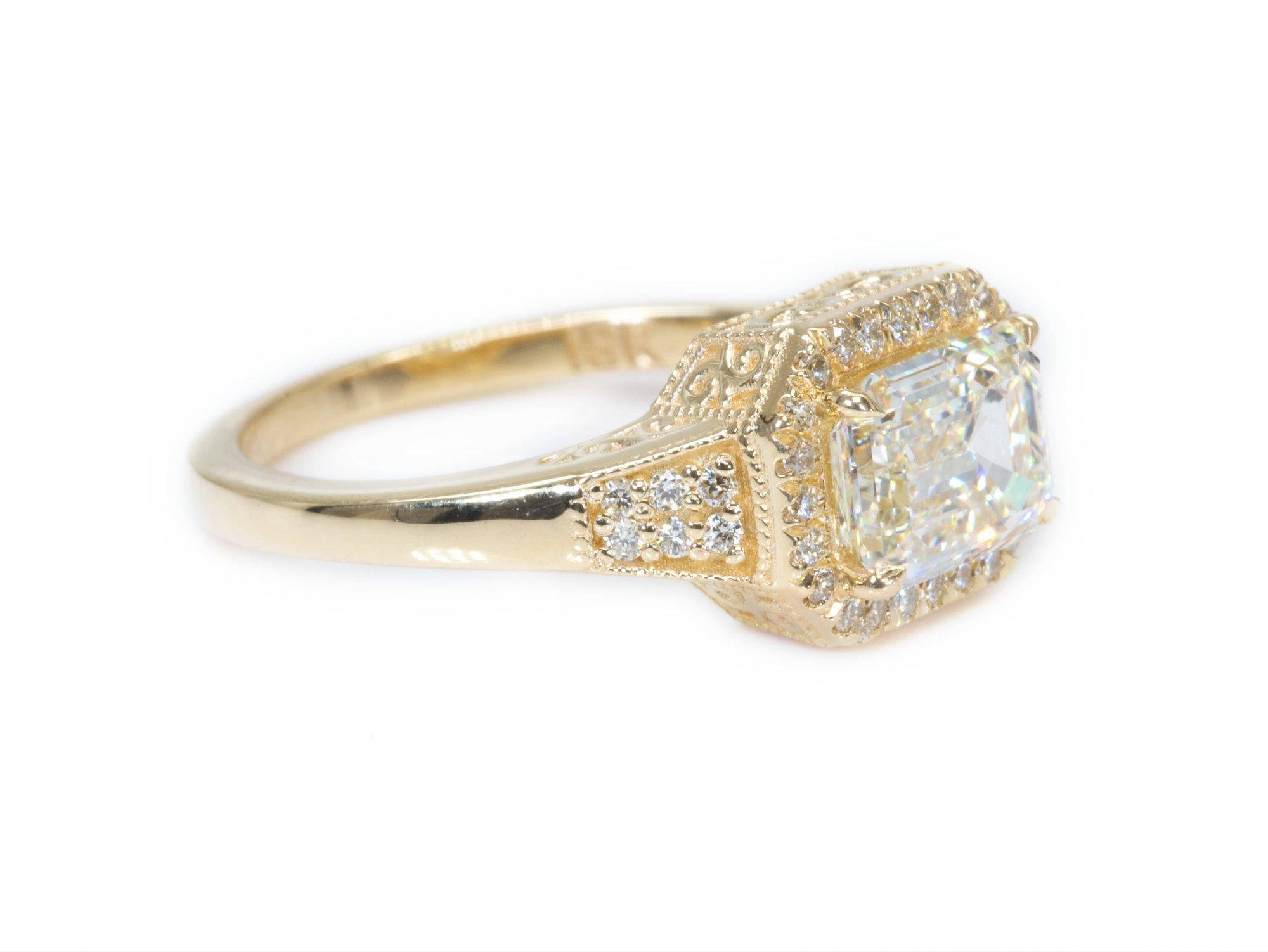 Ideal and brilliant natural emerald cut diamond with a 1.50 carat weight  mounted in Antique halo style ring with 0.17 carat of ideal and natural round brilliant diamonds made from 18k yellow gold ring with AIG certificate.

one of a kind ring 

Set