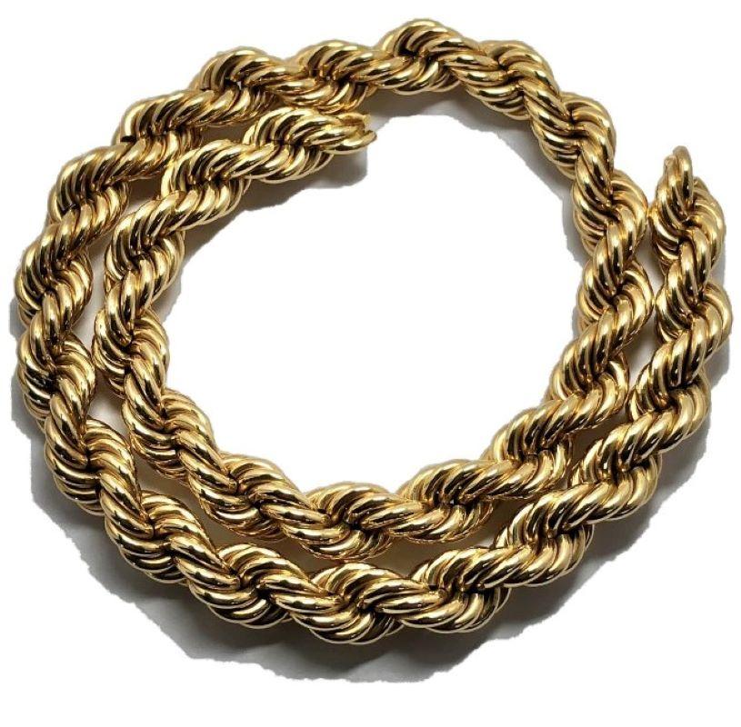 This wonderful classic rope necklace is crafted from 14k yellow gold showing the rich patina of age. It is 19 inches in length and very close to 1/2 inch in diameter making it a necklace of very significant appearance. Adding to the overall high