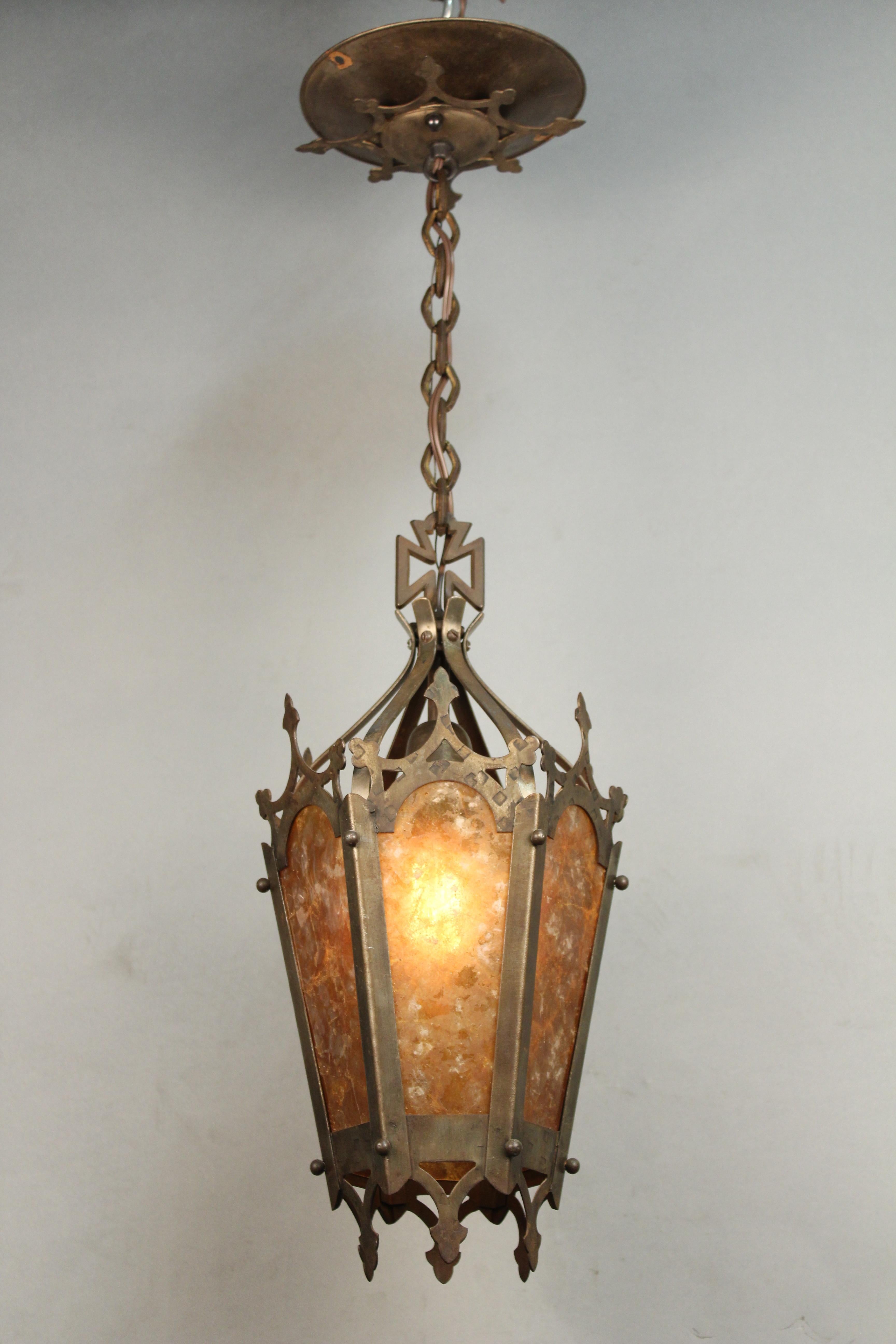 Pendant with original mica, circa 1920s. Measures: 18