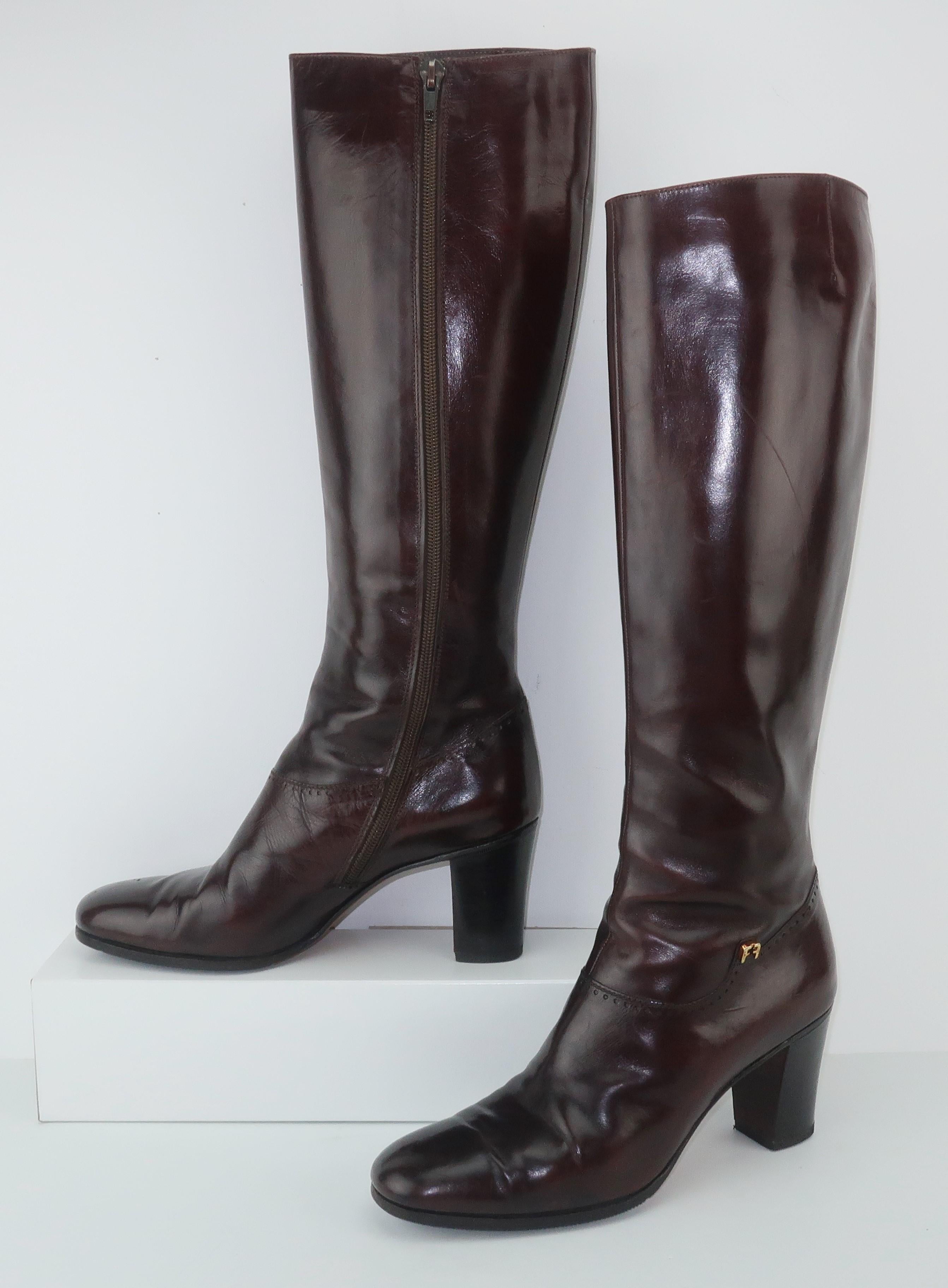 These Salvatore Ferragamo dark brown leather boots sport a classic 1970's style that is always in fashion.  The boot zips at the inner side and feature a hint of menswear detail with a subtle perforated design around the vamp reminiscent of wingtips