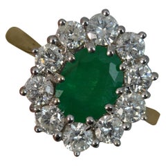 Classic 2.00 Carat Emerald 1.50 Carat Diamond 18 Carat Gold Cluster Ring
