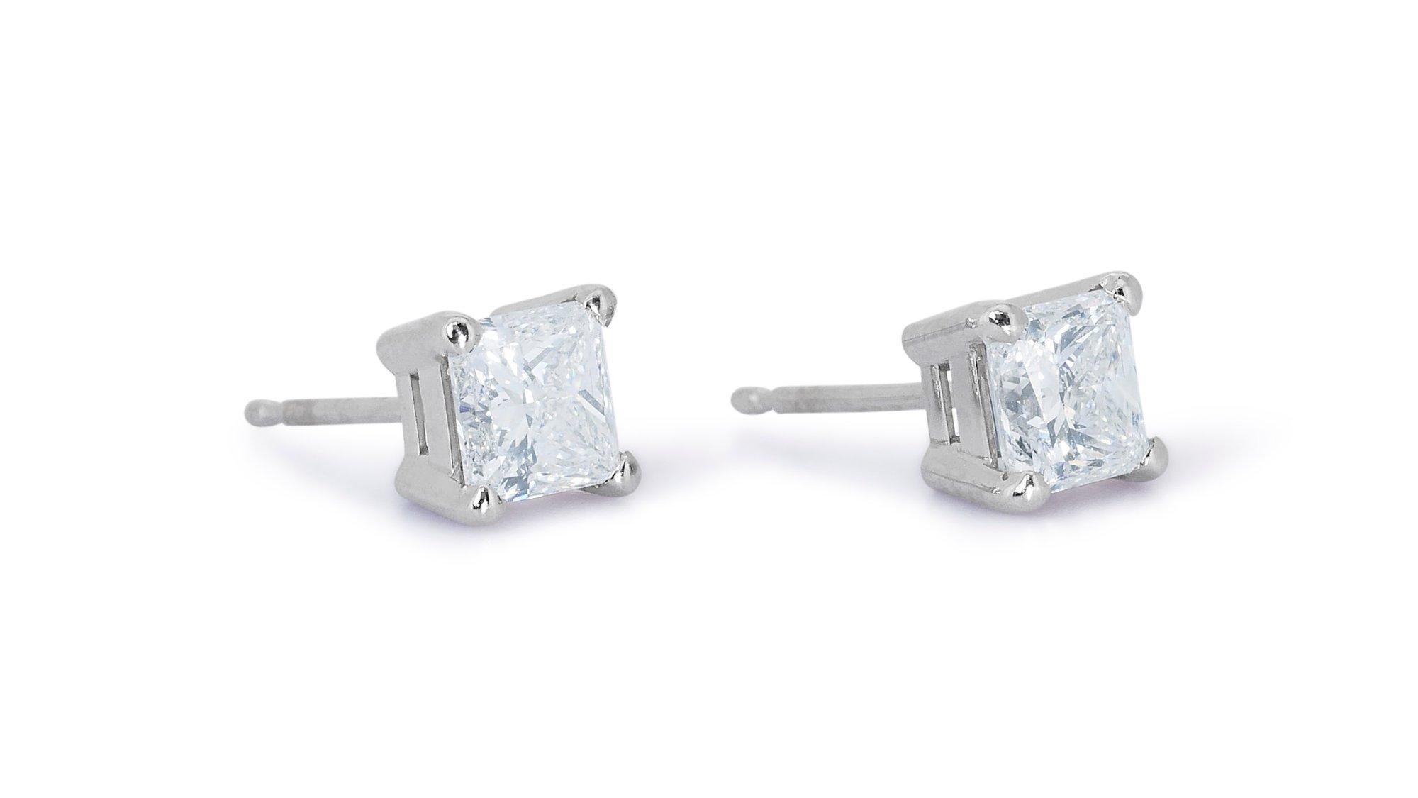 Classic 2.00ct Diamond Stud Earrings in 18k White Gold - GIA Certified

Experience elegance with these stunning diamond stud earrings crafted from 18k white gold. Each earring showcases a sparkling square diamond with a total carat weight of
