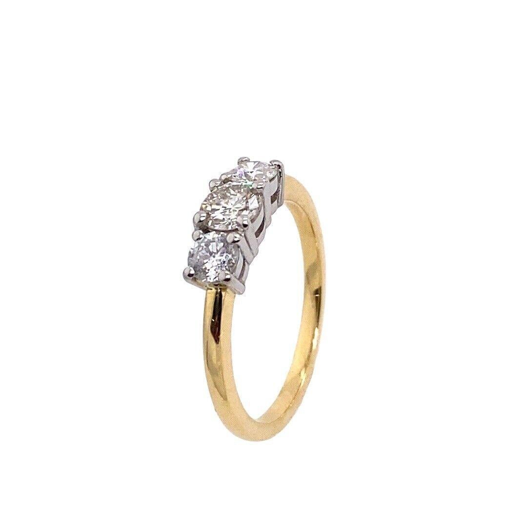 Classic 3-Stone Diamond Ring, Set In 18ct Yellow & White Gold, Set With 0.70ct Round Brilliant Cut Diamonds.

Additional Information:
Total Diamond Weight:0.70ct
Diamond Colour: J/K-G/H
Diamond Clarity: SI
Width of Band: 1.56mm
Width of Head: