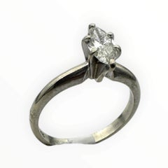 Classic .41 carat marquise–shaped diamond solitaire ring in 14 karat white gold