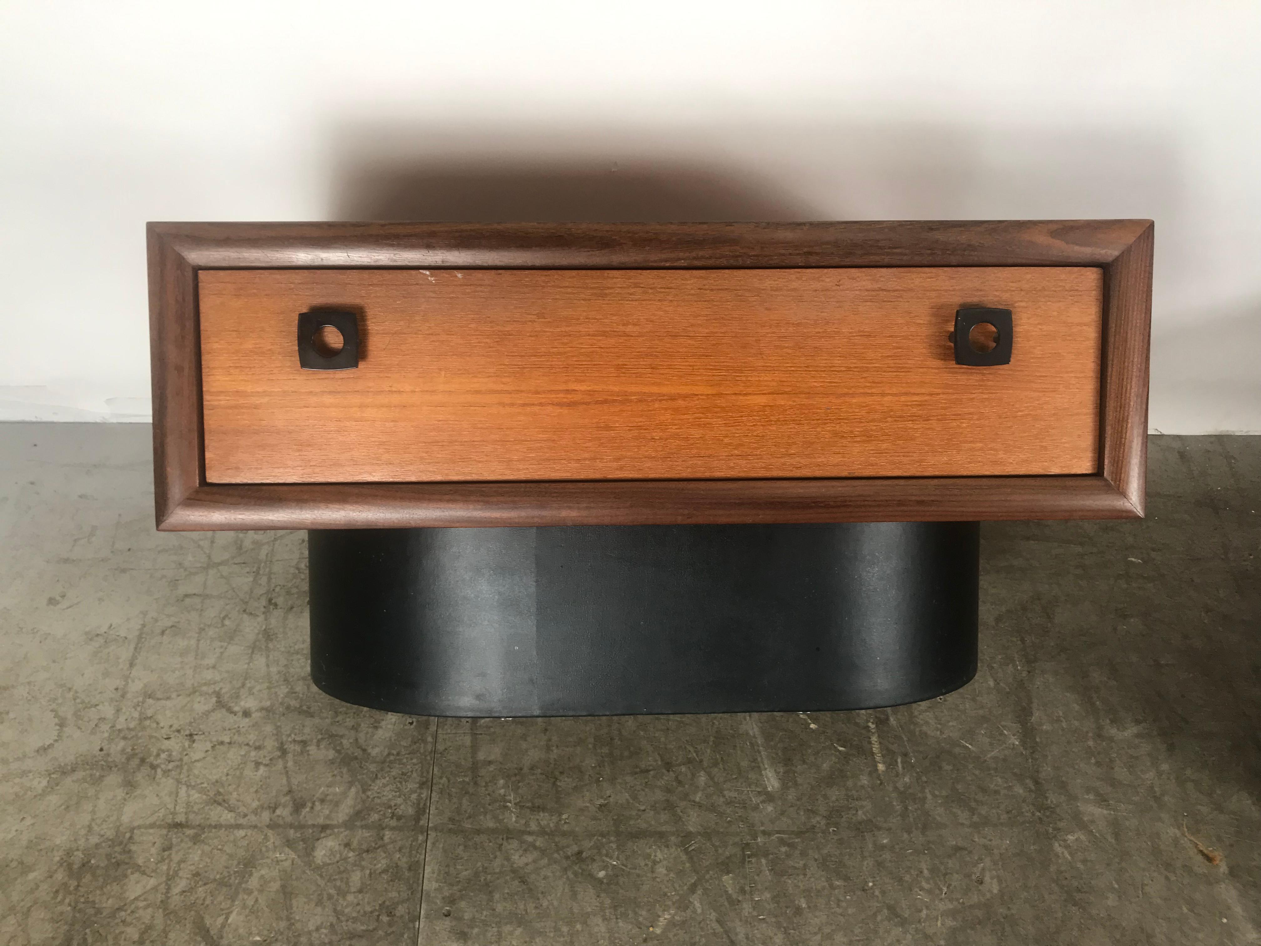 Classic 1970s teak and leather wrapped stands / end tables by RS Assocciates. Montreal. Stunning design,, Low profile,, oval leather wrapped base, metal pulls reminiscent of Ralph Lauren's designs. Each stand has one generous size drawer.