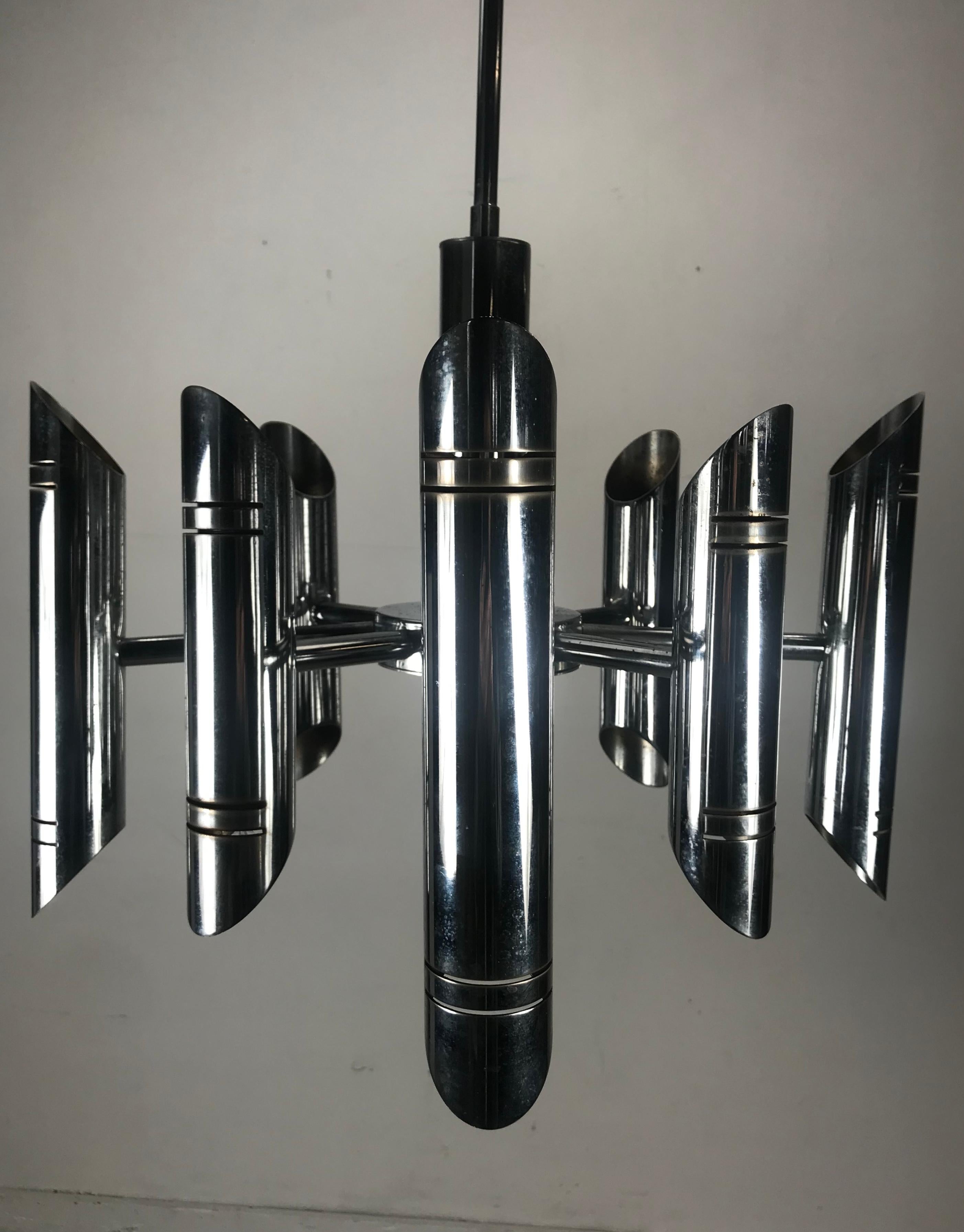Classic 8 arm, 16 bulb Italian modern chrome chandelier by Gaetano Sciolari..Amazing design, arms can be adjusted in multi-position. As desired. Presently 39 inch drop, Perfect addition to any sleek, simple, elegant environment.