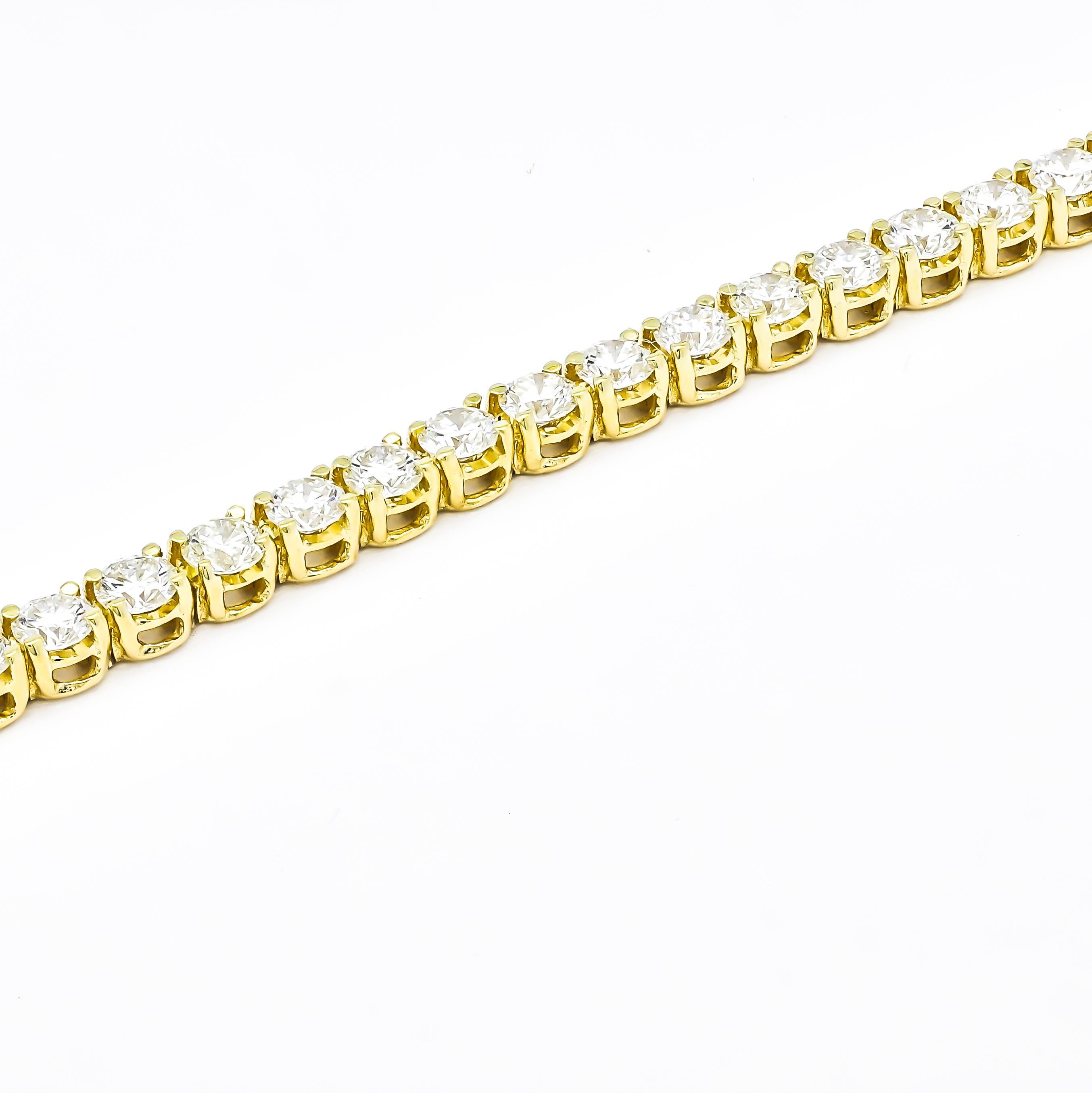 Indulge in the timeless allure of this classic 8.00 carat four-prong tennis bracelet. Meticulously crafted in 18K yellow gold, it embodies elegance and sophistication. Each natural diamond, meticulously selected for its exceptional quality, is