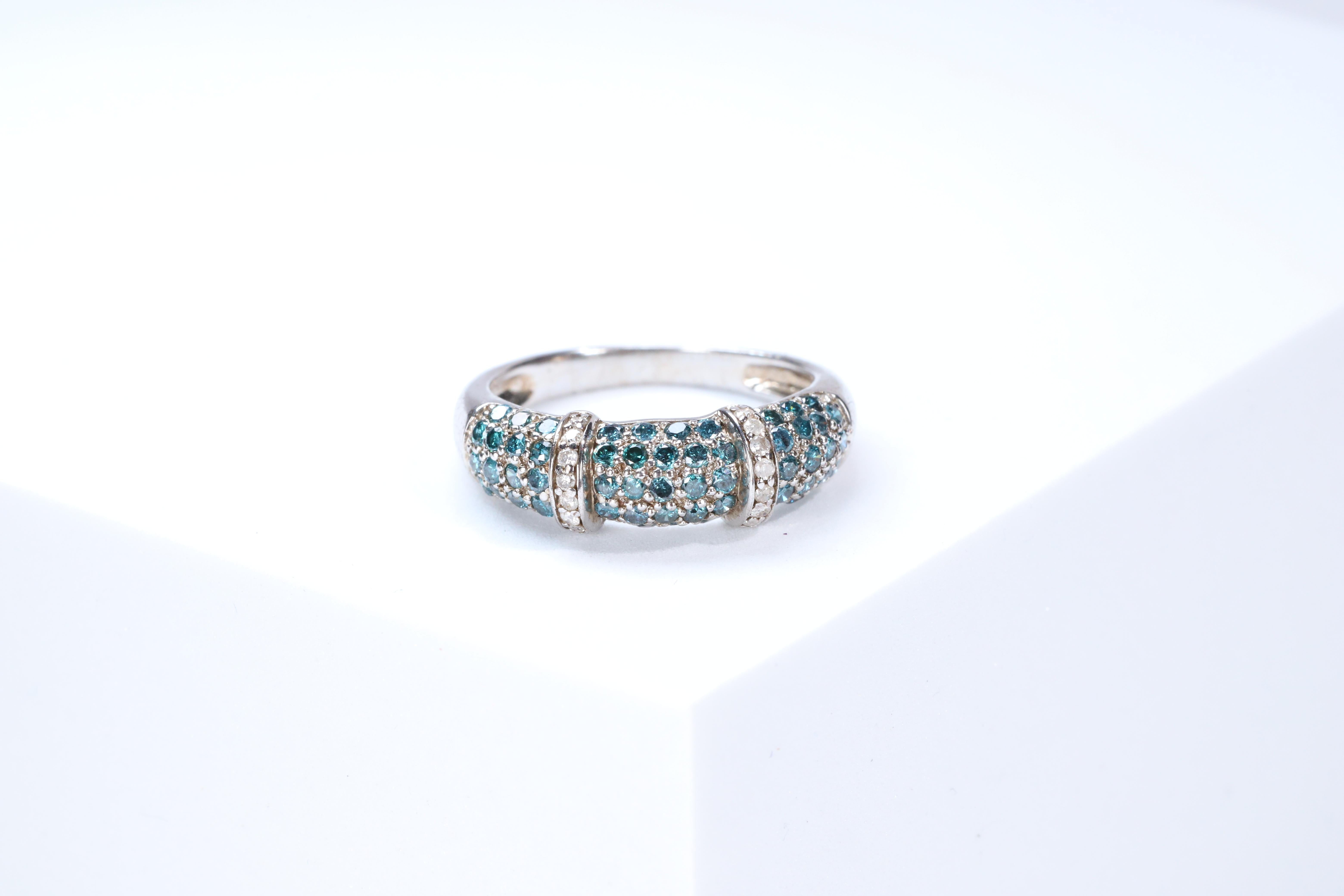 Stunning, timeless and classy eternity Unique Ring. Decorate yourself in luxury with this Gin & Grace Ring. The 925 Sterling Silver jewelry boasts with Natural Round-cut white Diamond (16 Pcs) 0.10 Carat, Blue Diamond (59 pcs) 0.82 carat accent