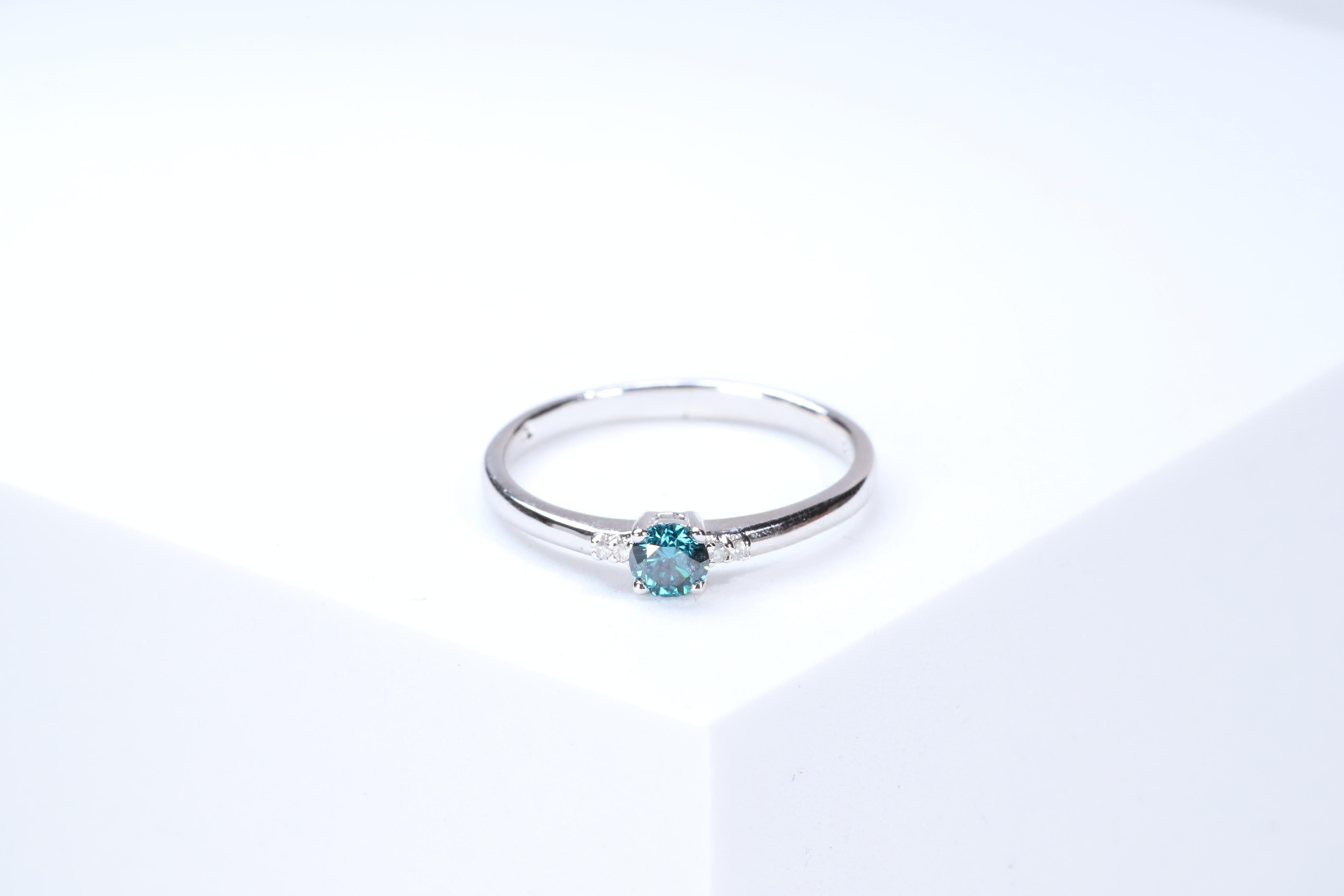 Stunning, timeless and classy eternity Unique Ring. Decorate yourself in luxury with this Gin & Grace Ring. The 925 Sterling Silver jewelry boasts with Natural Round-cut white Diamond (4 Pcs) 0.02 Carat, Round-cut Blue Diamond (1 pcs) 0.27 carat