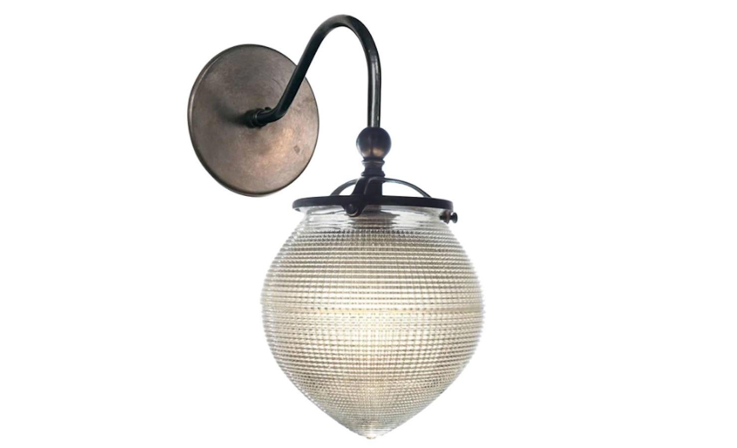 This acorn shaped shade is a favourite. The style was mainly used as lighting for dentists. The shape is very pleasing and makes a perfect simple sconce. The thick prismatic glass gives off beautiful even light.