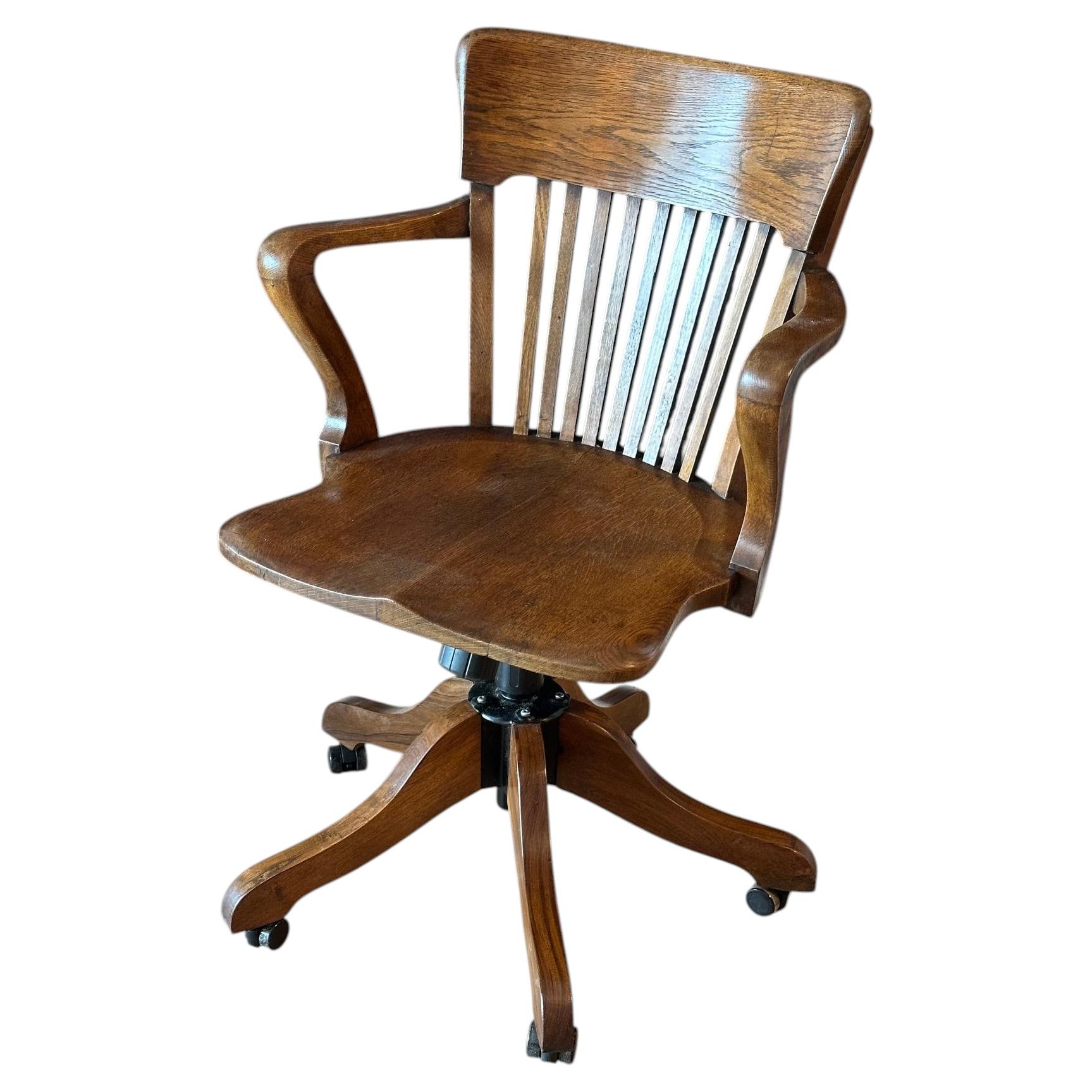 Classic adjustable oak office chair in mint condition For Sale