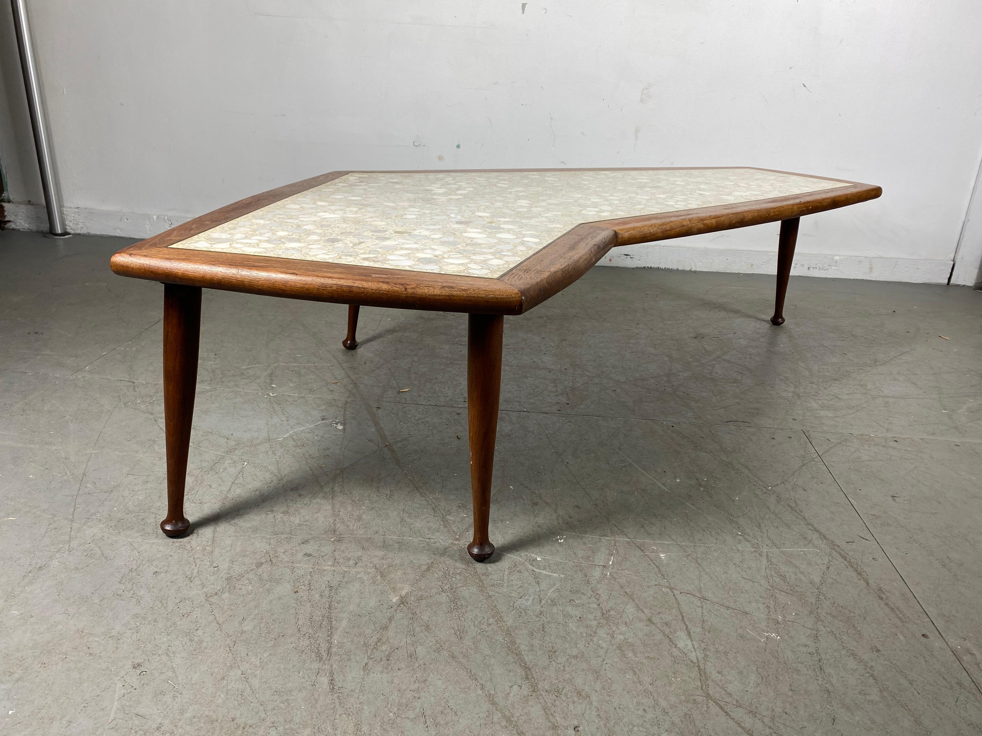 Classic American modernist walnut and inlay stone boomerang coffee/ cocktail table, solid walnut frame, wonderful variety of mixed stone, handsome design, unusual foot detail, retains original finish, patina, age appropriate wear, hand delivery