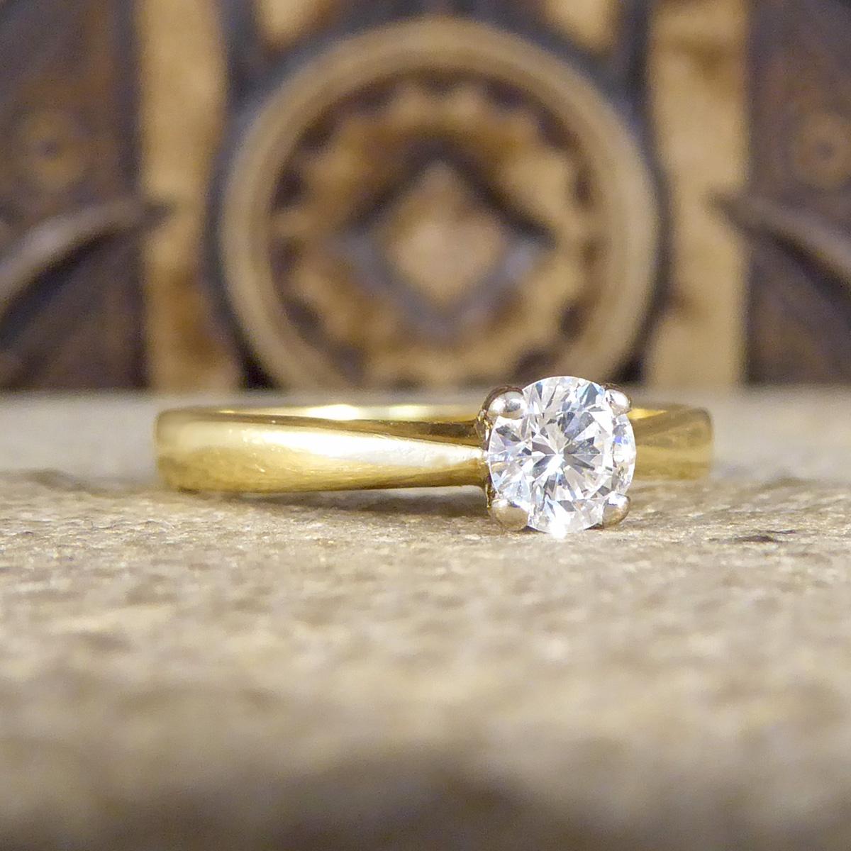This beautifully sparkly ring holds a Brilliant Cut Diamond weighing 0.25ct and is set in 18ct Yellow Gold in a four claw setting allowing lots of light to flood through the stone letting it sparkle. A classic solitaire ring with style that stands