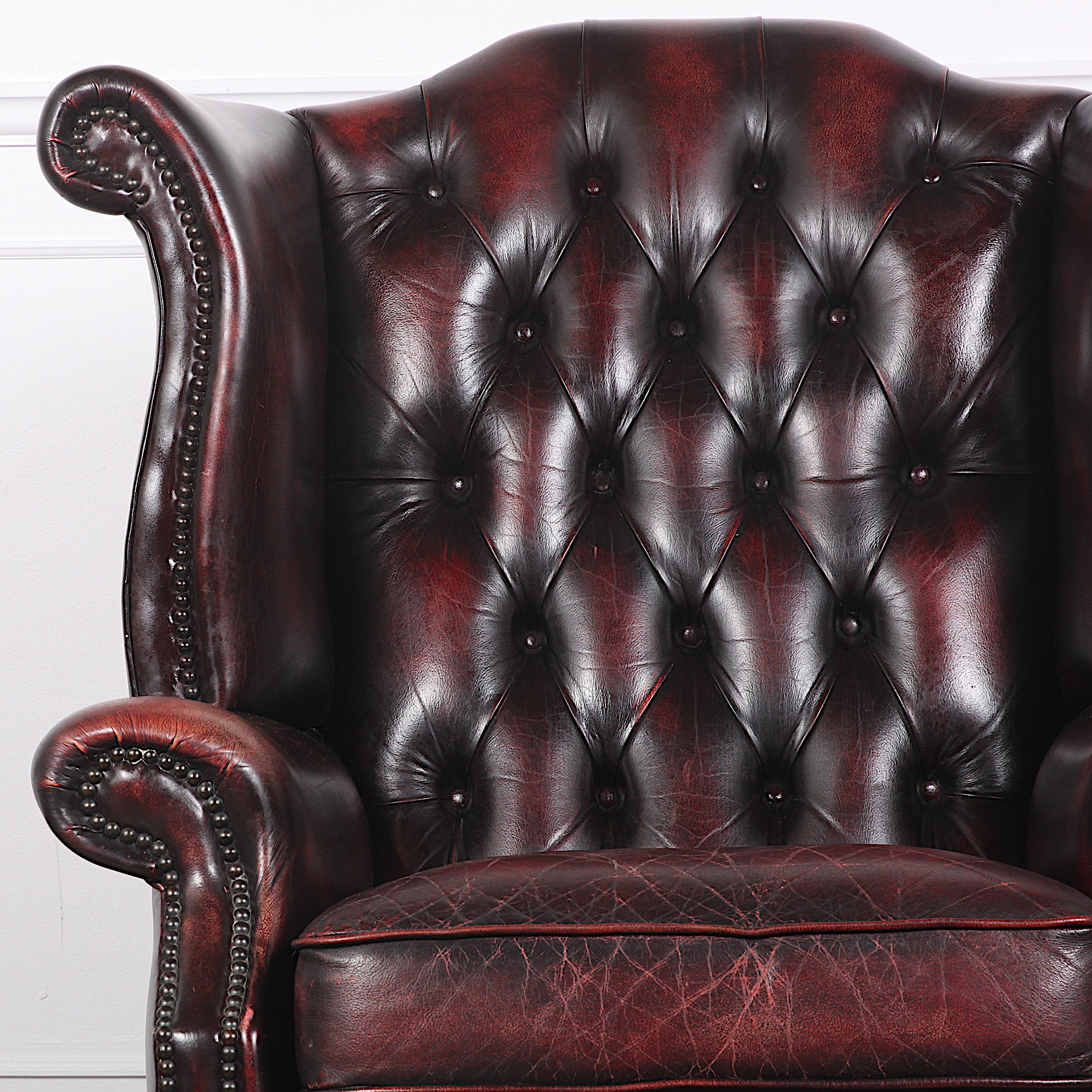 English made deep button tufted wingback chair.