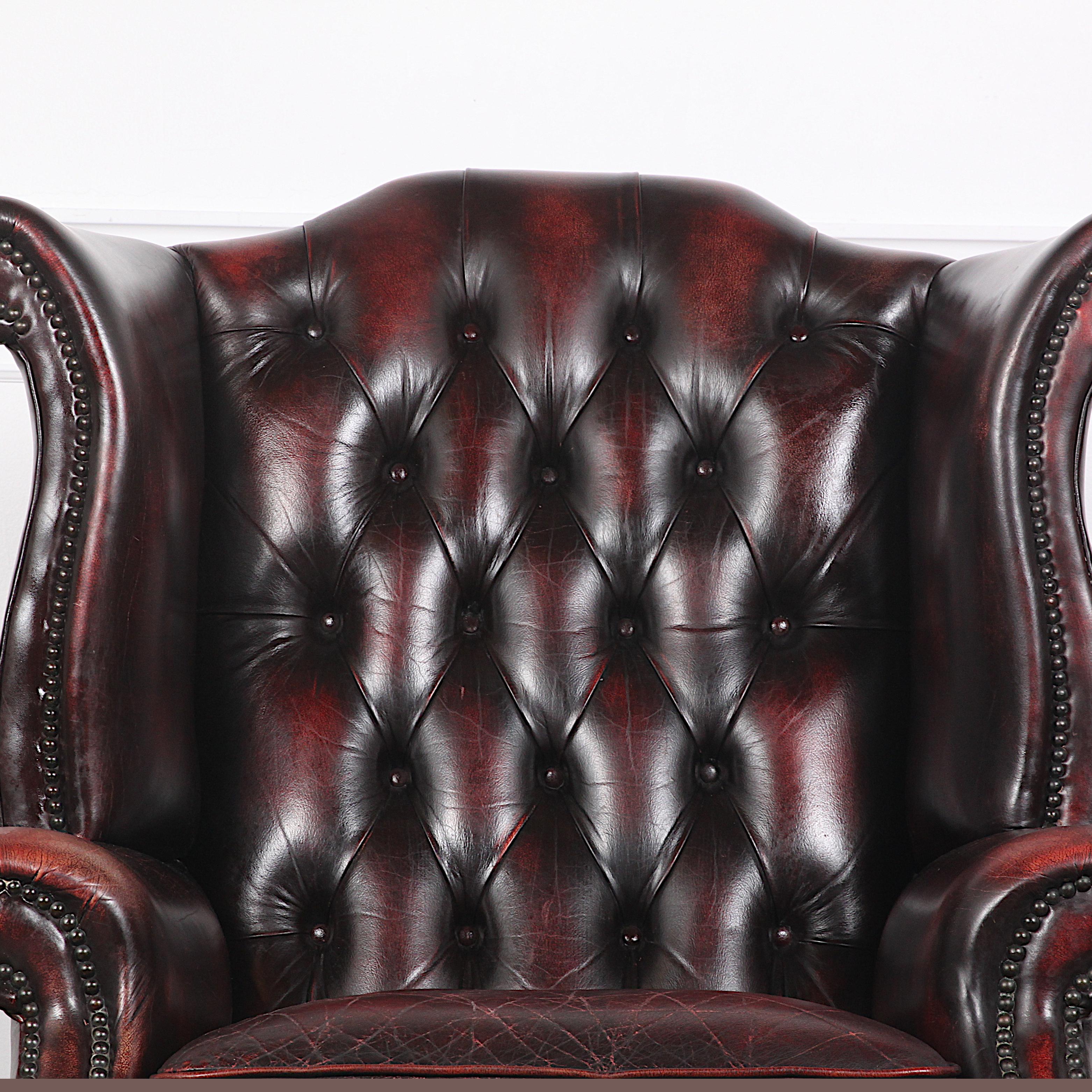 handsome looking oxblood leather wingback armchair