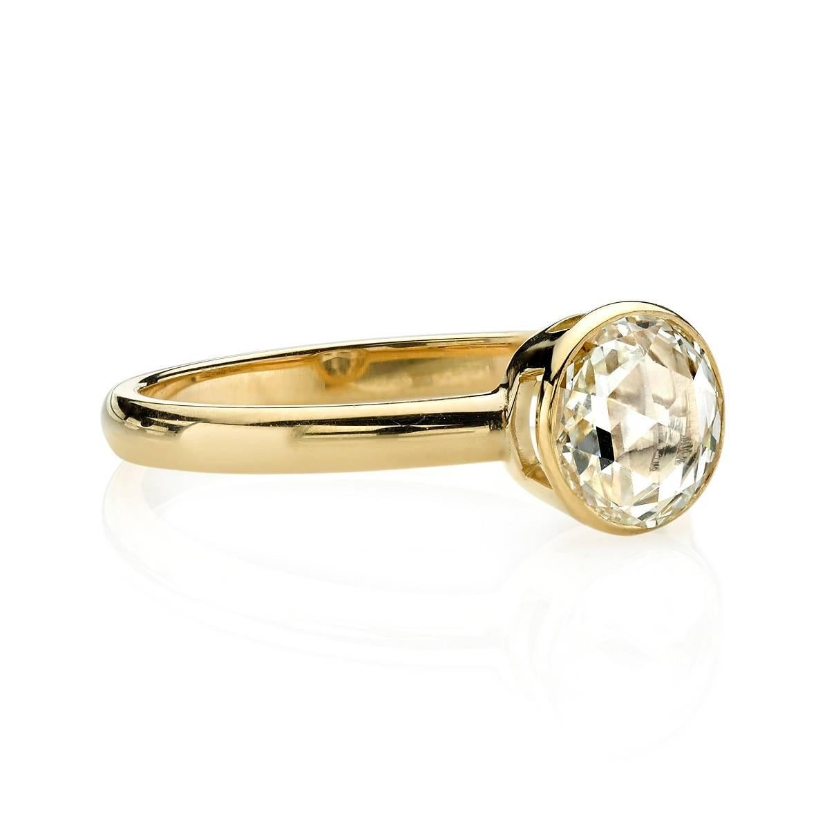 0.68ct F/VS2 EGL certified Rose cut diamond set in a handcrafted 18k yellow gold setting. A unique take on a solitaire design.