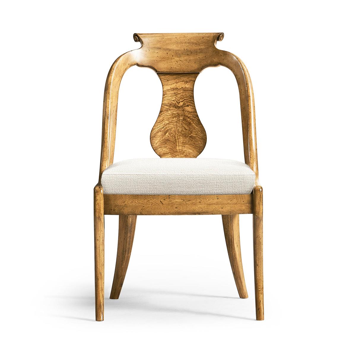 Featuring a gracefully curved urn form splat back adorned with exquisite figured Cerejeira veneers, known for their beautiful swirling patterns that captivate the eye. The veneers flow elegantly down the back, drawing attention to the chair's