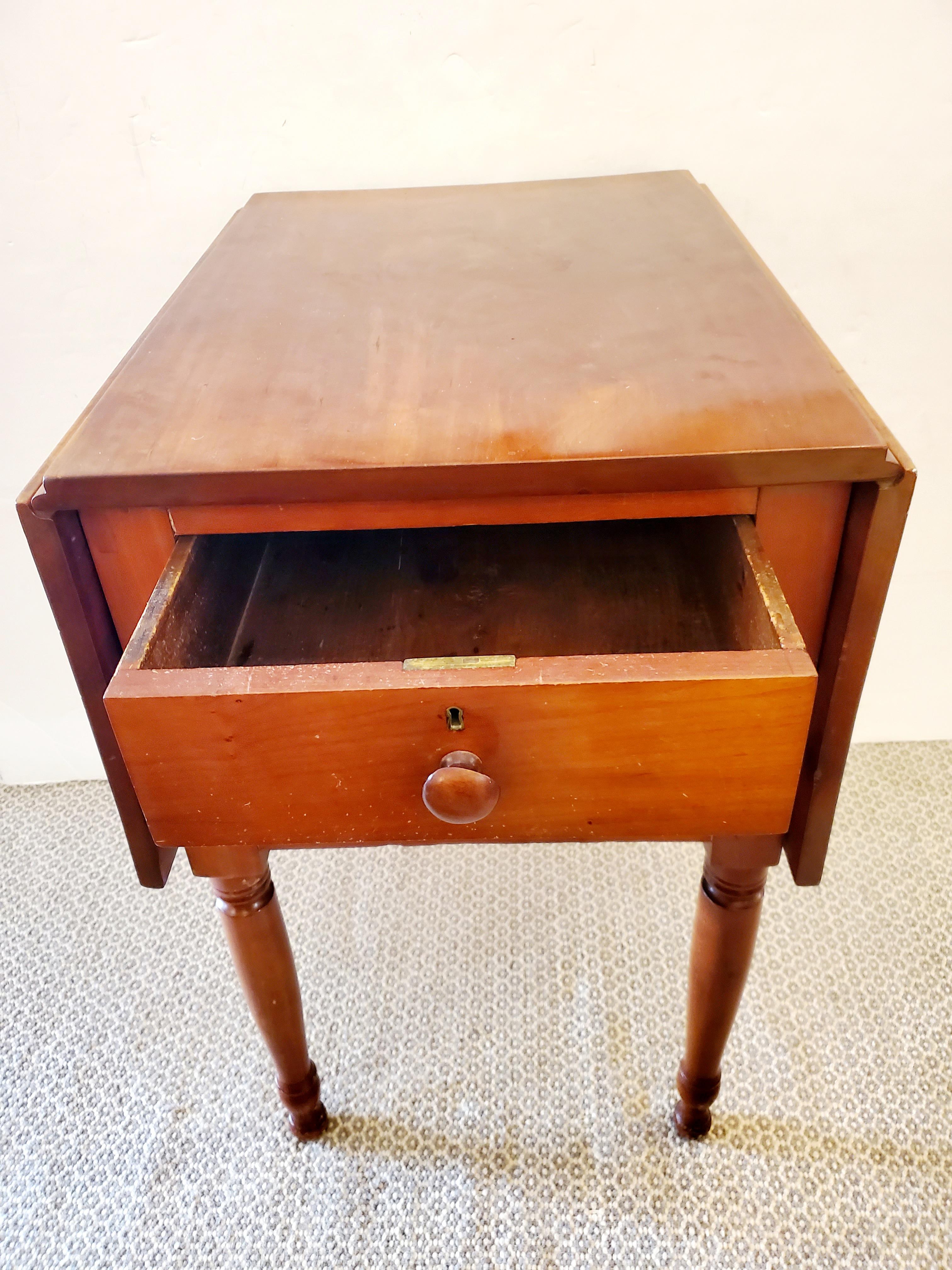 Classic and simple cherry drop leaf side table having two drawers and turned legs. When open 40.5 W
From the estate of Gertrude Watkins, a suffrage activist.