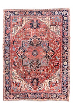 Classic Antique Heriz Carpet with a Red Field and Blue Accents