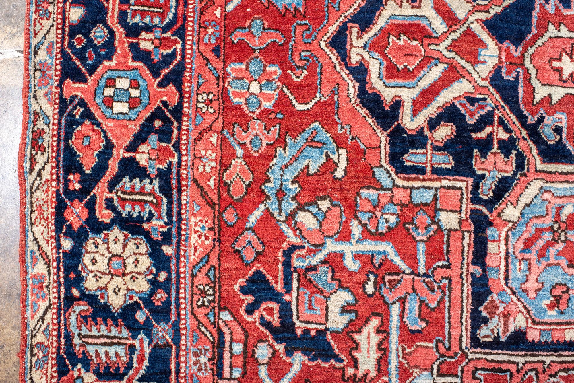Classic Antique Heriz Carpet with a Red Field and Blue Accents In Good Condition For Sale In New York, NY