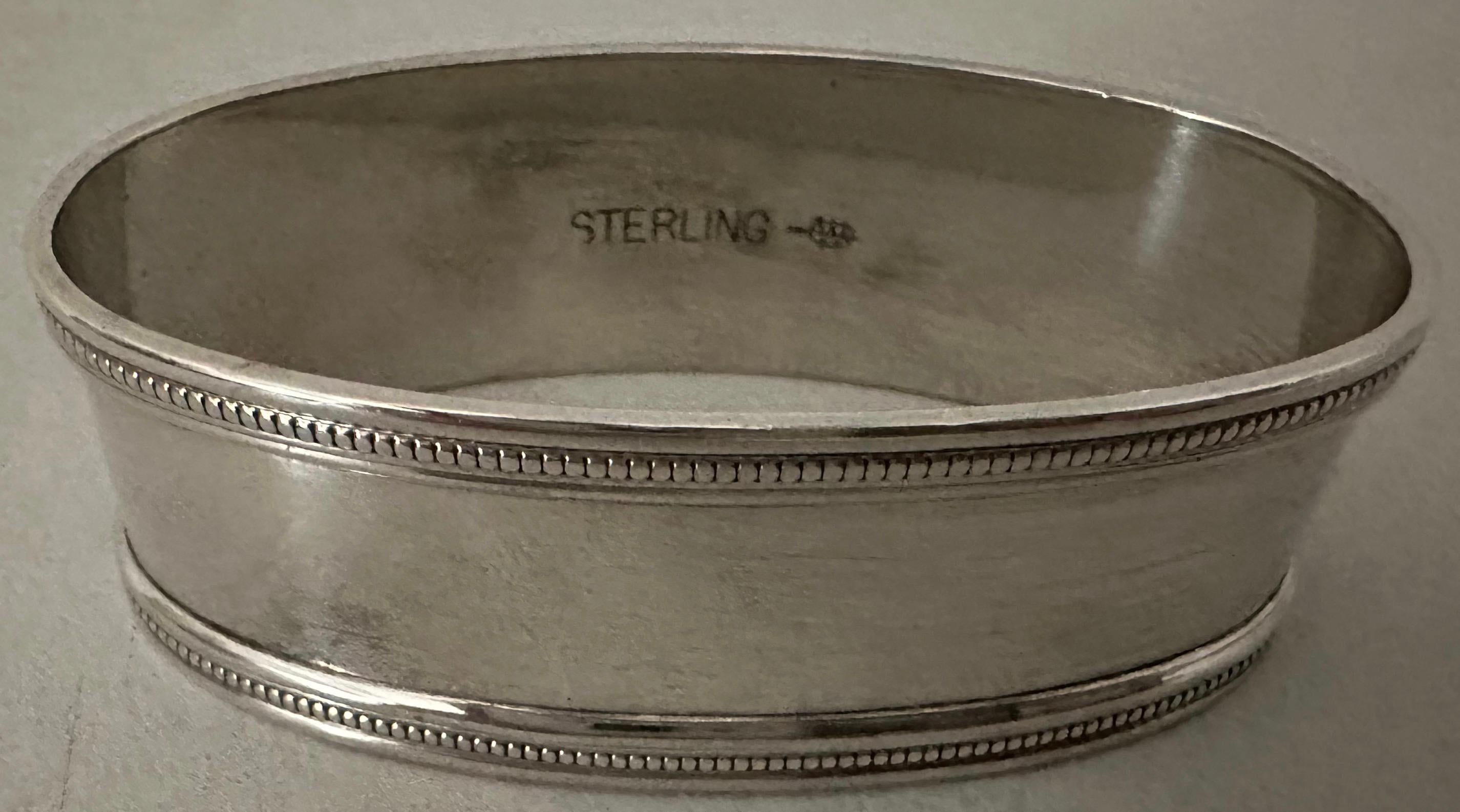 Treat yourself or a friend  to this simple elegant and classic oval sterling napkin ring stamped 