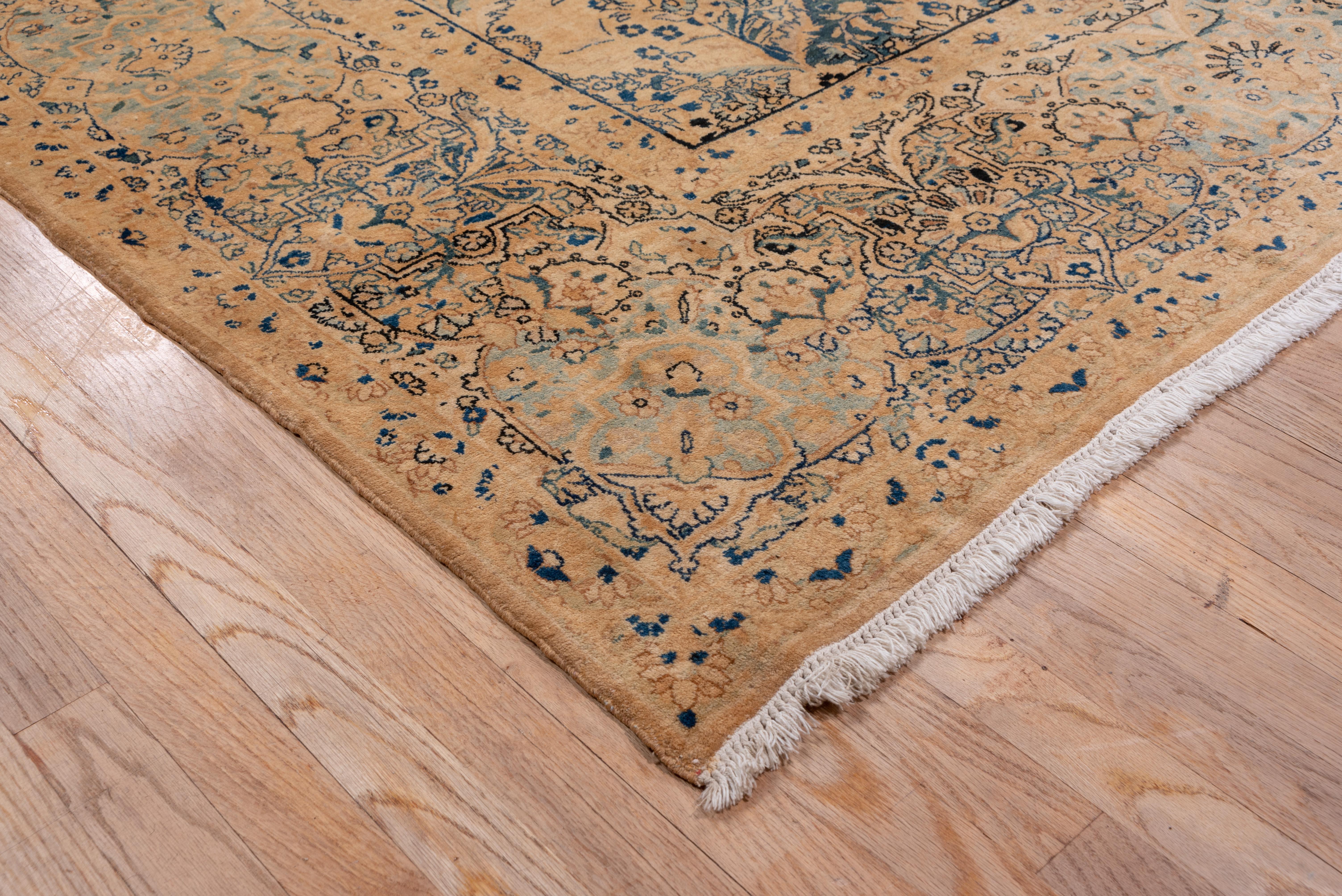 A Classic/ covered ground period SW Persian city weaving, the field is tessellated into hexagonal panels by a leaf lattice, and each section contains a stylized flower, all in tones of dark blue, pale blue, cream, buff, light pistachio and straw.