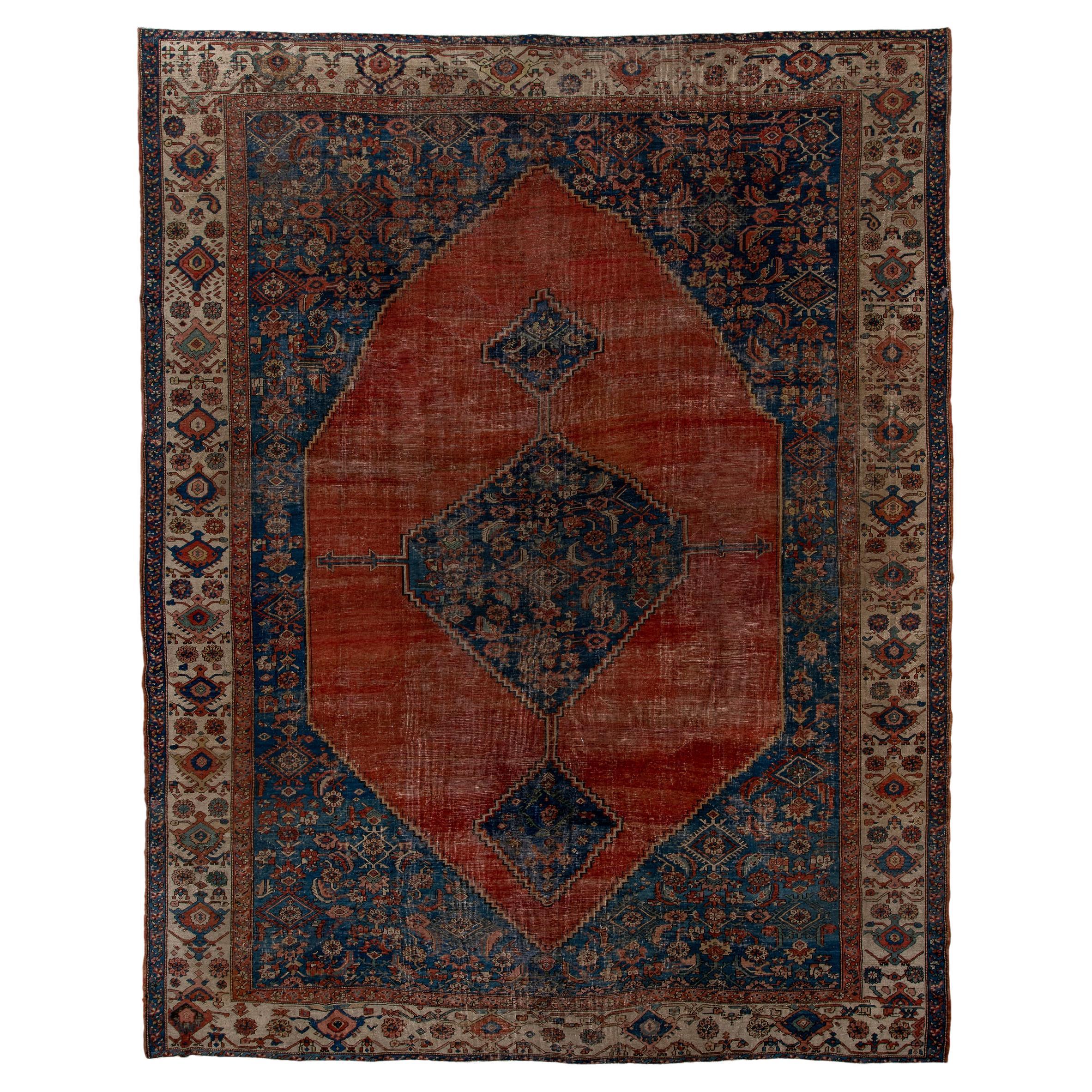 Classic Antique Serapi with a Blue and Red Field and a Blue Medallion  For Sale
