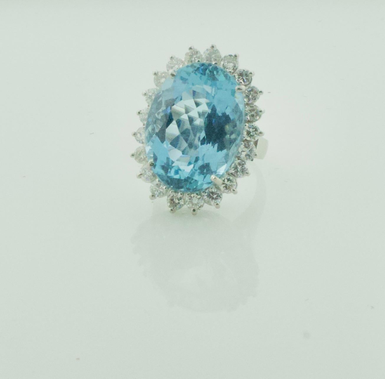 Classic Aquamarine and Diamond Ring in Platinum
One Oval Aquamarine Weighing 14.50 Carats Approximately [bright with no imperfections visible to the naked eye]
21 Round Brilliant Cut Diamonds Weighing 1.15 Carats Approximately [GHI- VS-SI1]