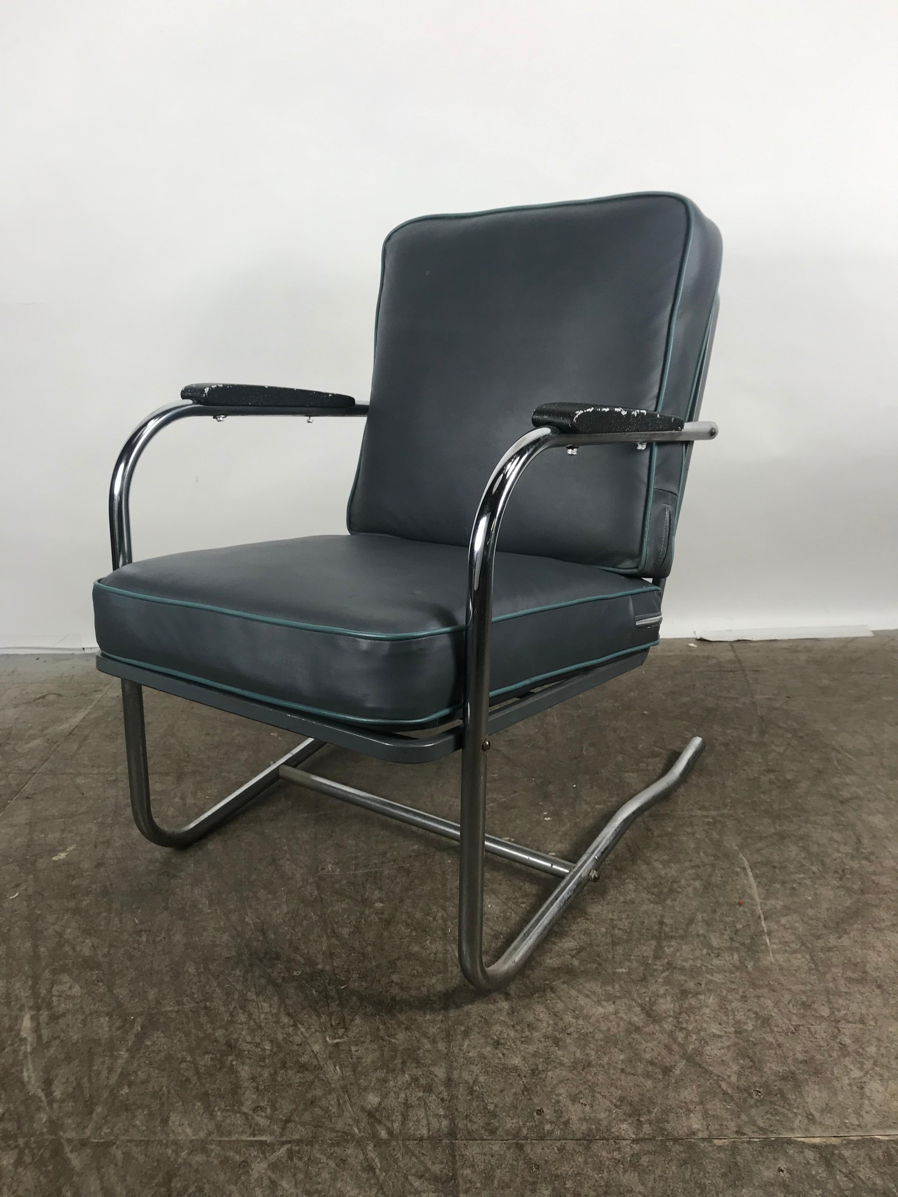 Classic Art Deco, Bauhaus tubular chrome lounge chair. Cantilever chrome frame, recently upholstered in a blue Naugahyde fabric with baby blue piping, extremely comfortable.