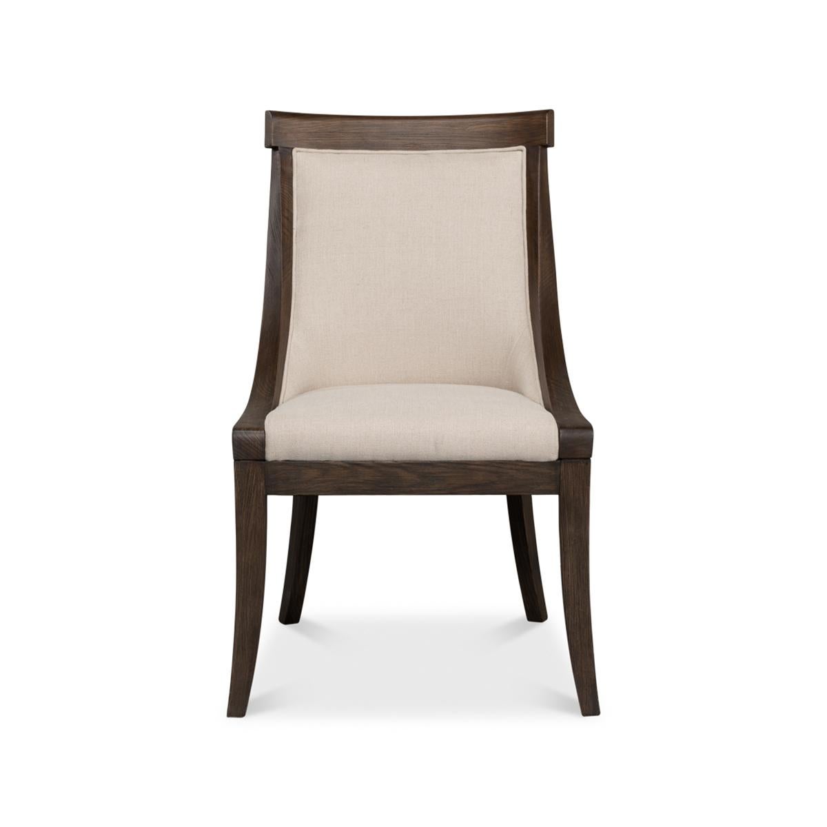 Classic ash dining chair, a timeless classic that adds drama, commands attention, and often brings all the design elements of a room into a cohesive focus. With exposed beautifully finished Ash framing and a luxurious linen cover.

The curved