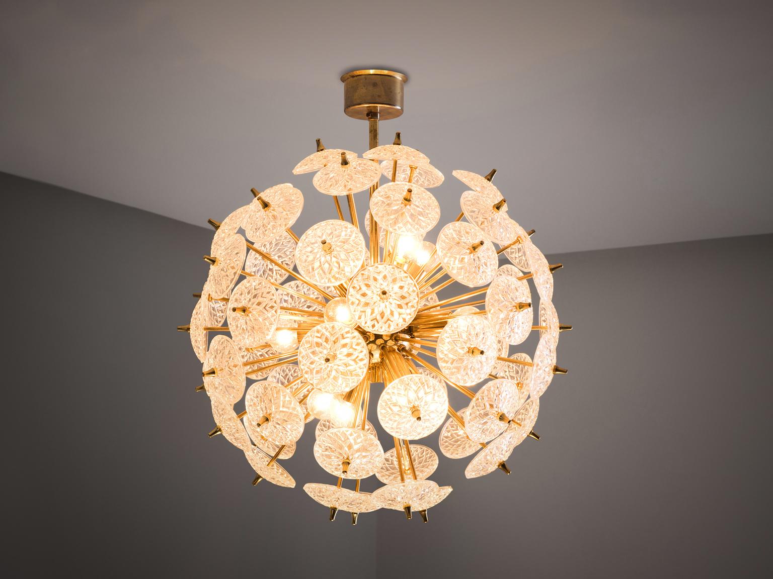 Sputnik chandelier, in glass and brass, Austria, 1950s. 

Large brass 'roset' Sputnik chandelier, made in Vienna in the 1950s, in the style of Emil Stejnar. The pendant consists of glass flowers and a brass frame that are frivolous and classic at