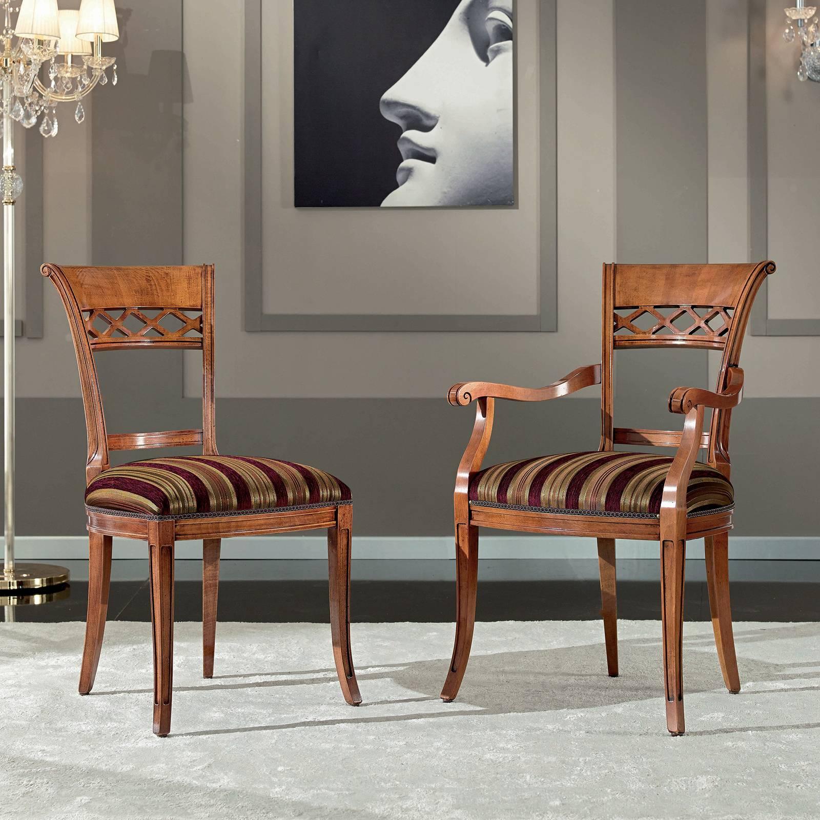 Fashioned entirely of wood, this classic chair will infuse timeless sophistication into any decor. The distinctive backrest is characterized by a bold top rail half solid and the other with a hallowed out 