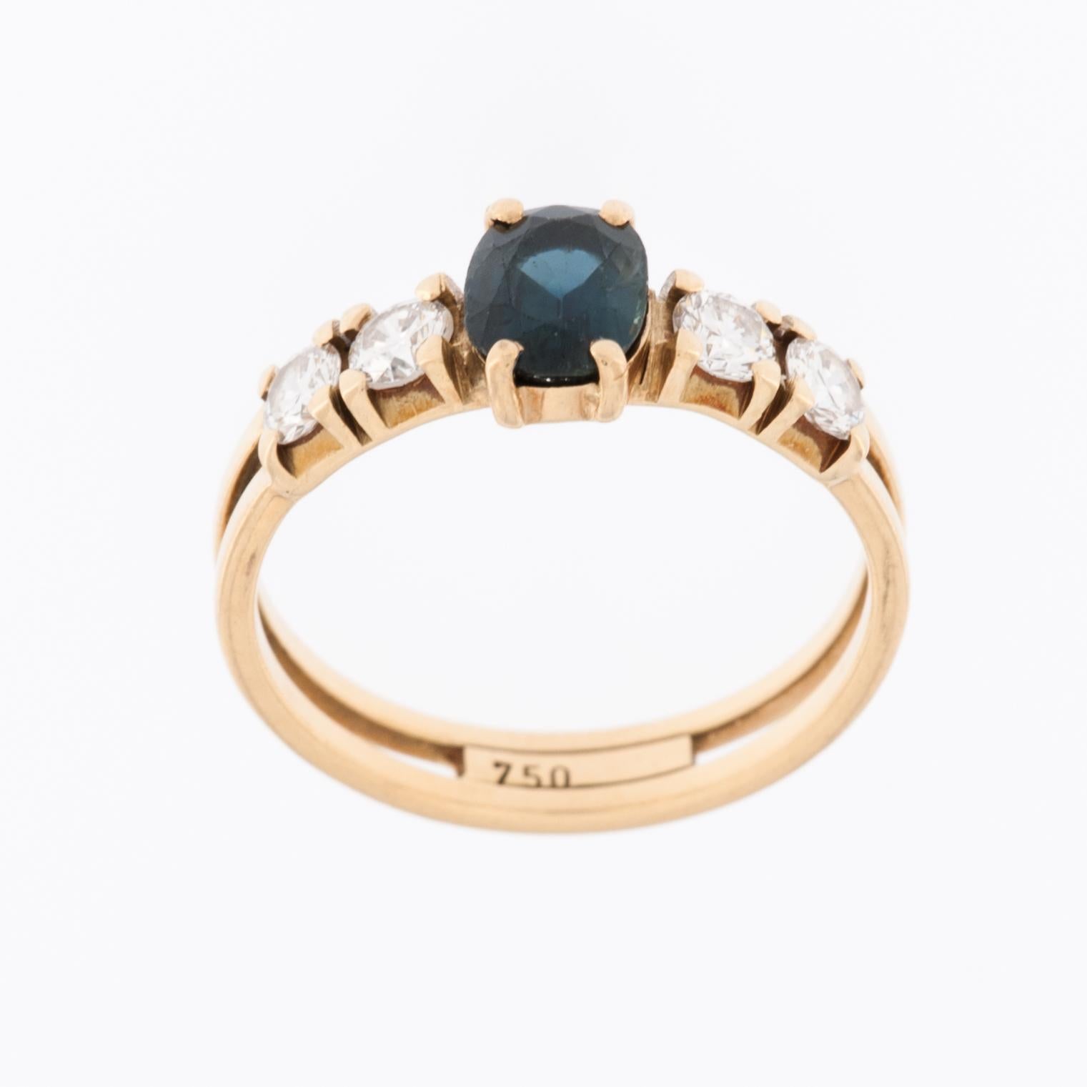 This classic Belgian ring is a timeless piece of jewelry crafted from lustrous 18kt yellow gold. The use of high-quality gold not only ensures a luxurious appearance but also provides durability and lasting beauty. The ring is adorned with both