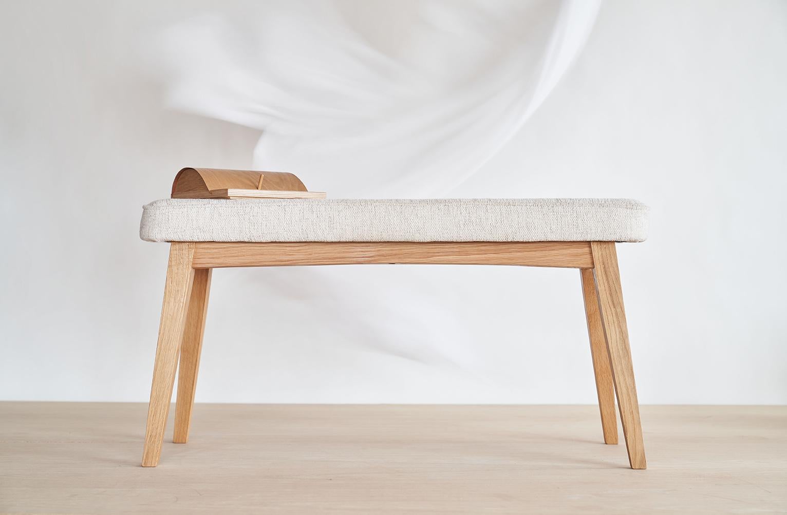 Classic bench by Jean-Baptiste Van den Heede
Dimensions: L 87 x D 29 x H 45 cm
Materials: oak, textile.
Also available: other finishes and woods available.

Upholstered bench in oak, walnut or other woods on request. A practical piece of
