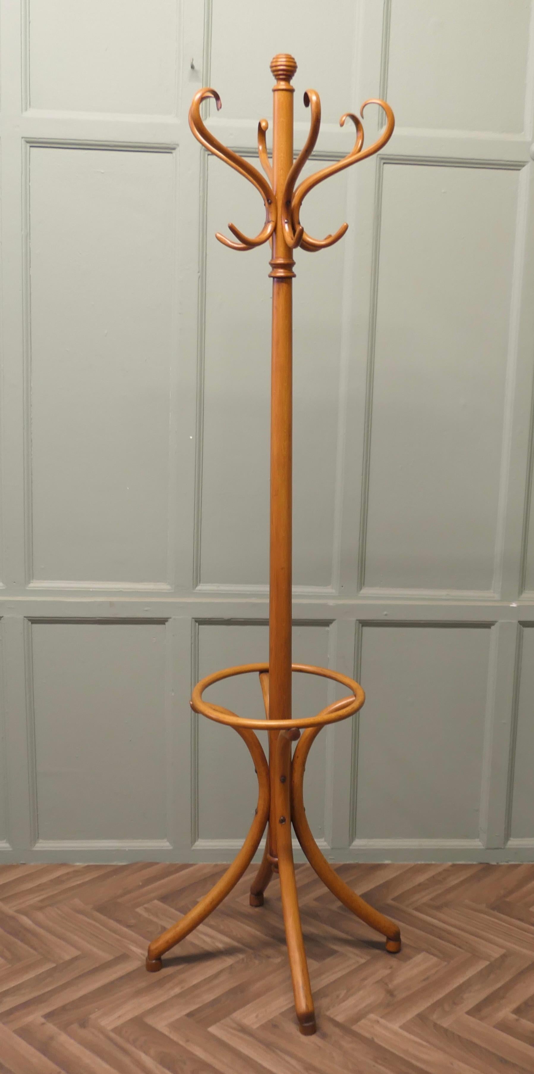 Classic Bentwood Coat and Hat Hall Stand

This is a very attractive piece it is a Round Hat & Coat Hall Stand, the stand has 6 Large Curved Bentwood Hat & Coat Hooks at the top and 4 splayed legs forming the umbrella receptacle at the bottom
The