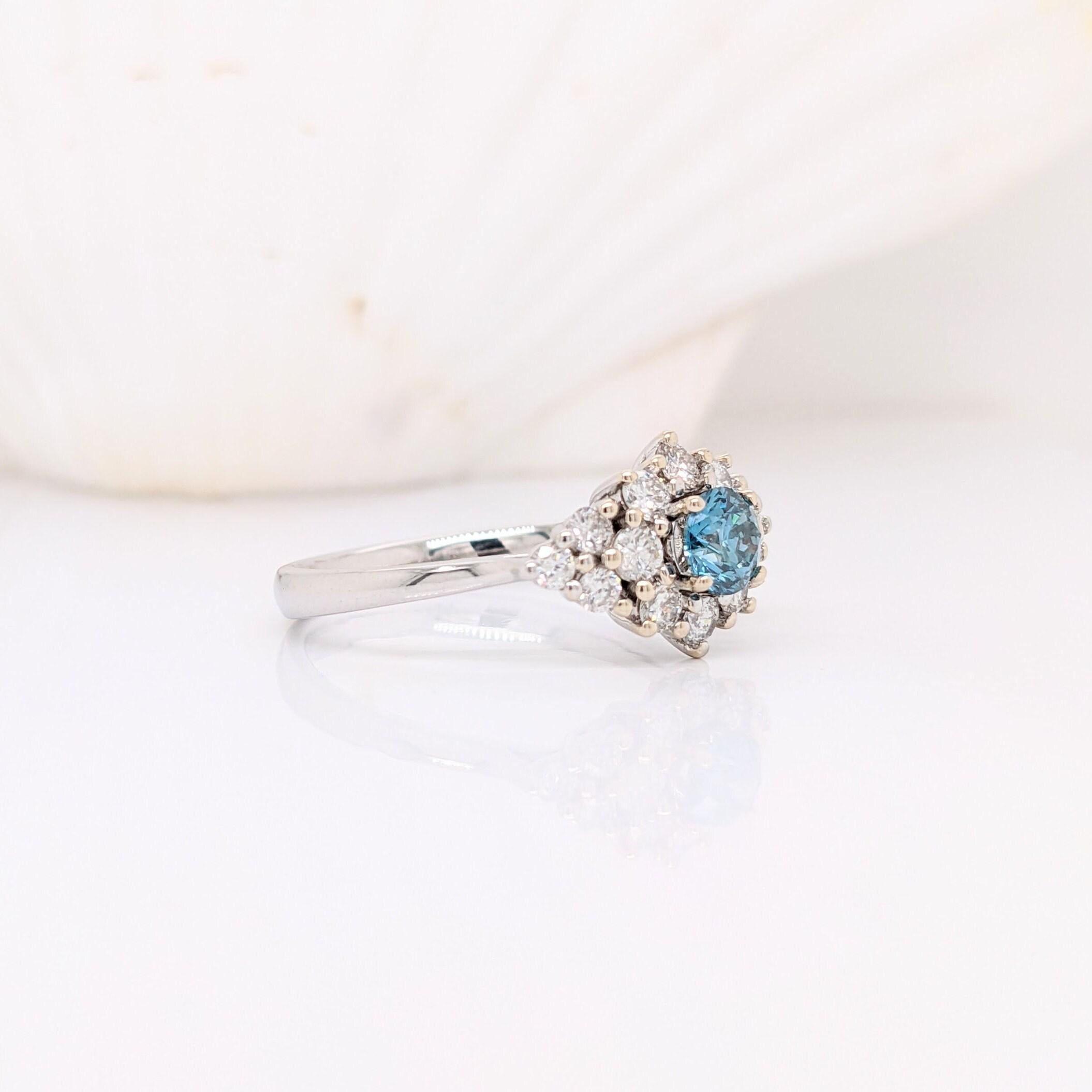 We've set this light Blue diamond with loads of white diamond accents to create the most sparkly and luxurious ring.  Diamonds are set in solid 14K gold with strong prongs to allow you be able to wear it worry free daily! 

Specifications

Item