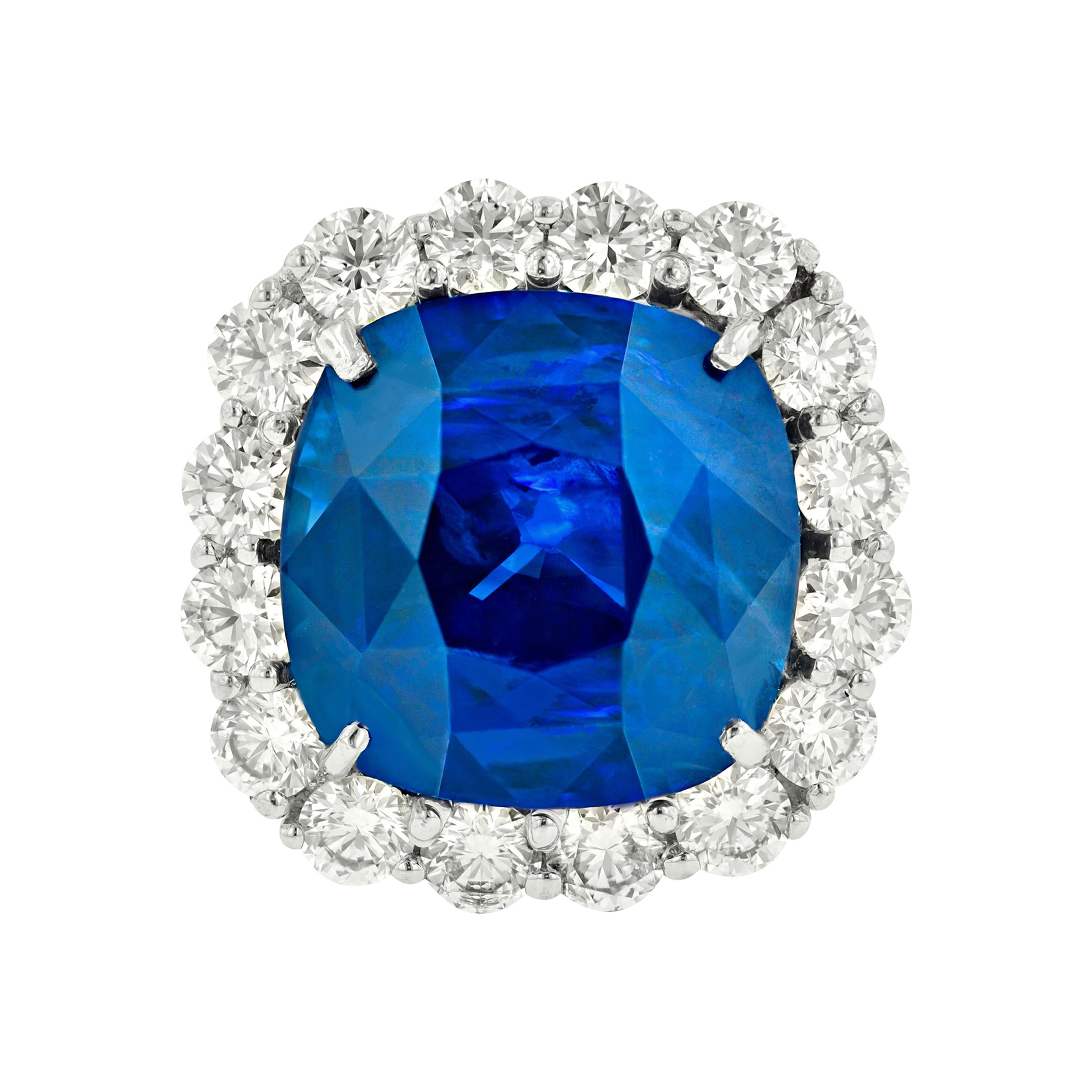 Classic Blue Sapphire Ring in Platinum Setting with Round Diamonds For Sale