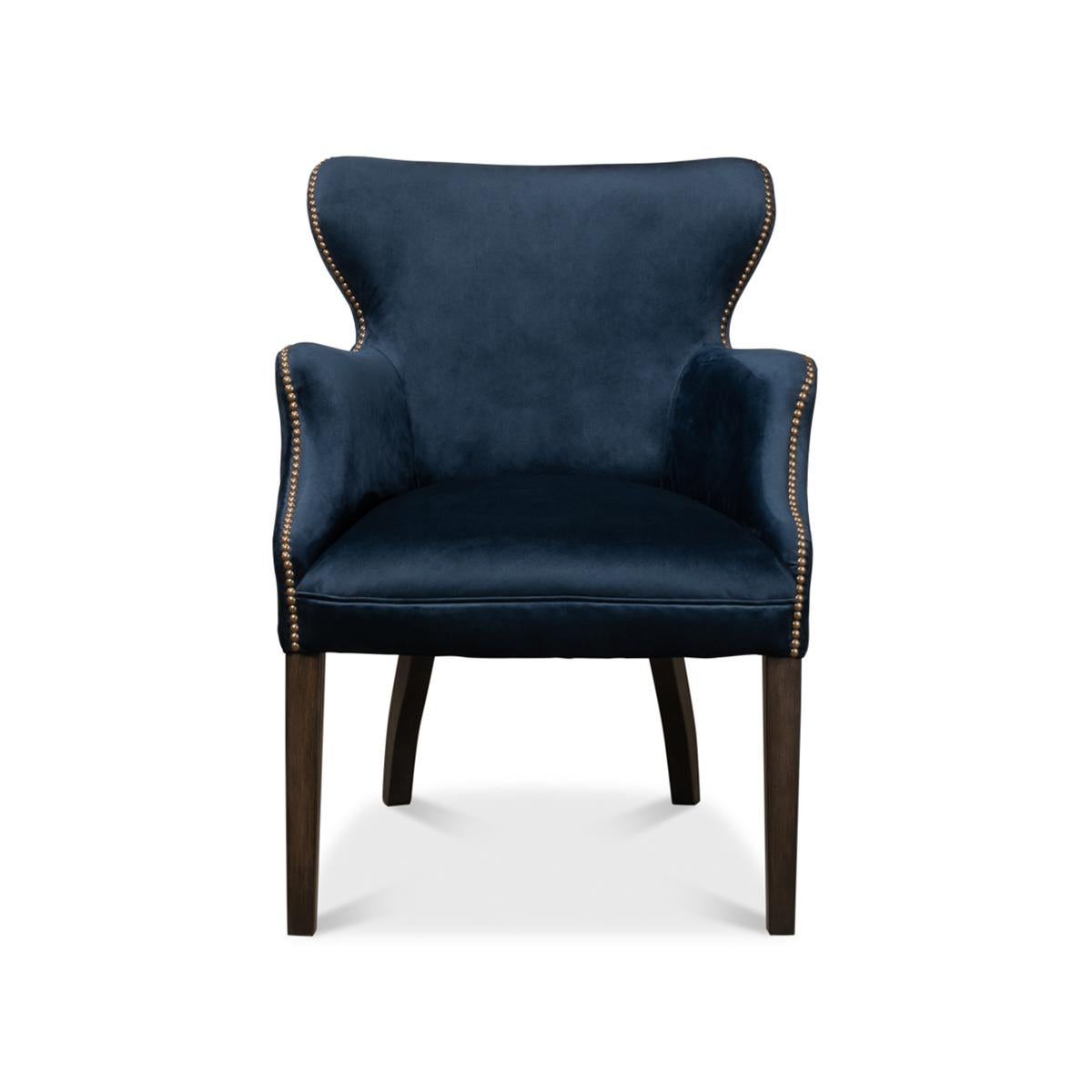 The rich deep blue velvet blends perfectly with the polished finish to the legs and the brass nailhead trim details.

Dimensions: 30
