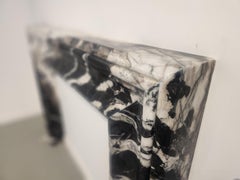 Classic Bolection Stone Fireplace in a Modern Black and White Quartzite