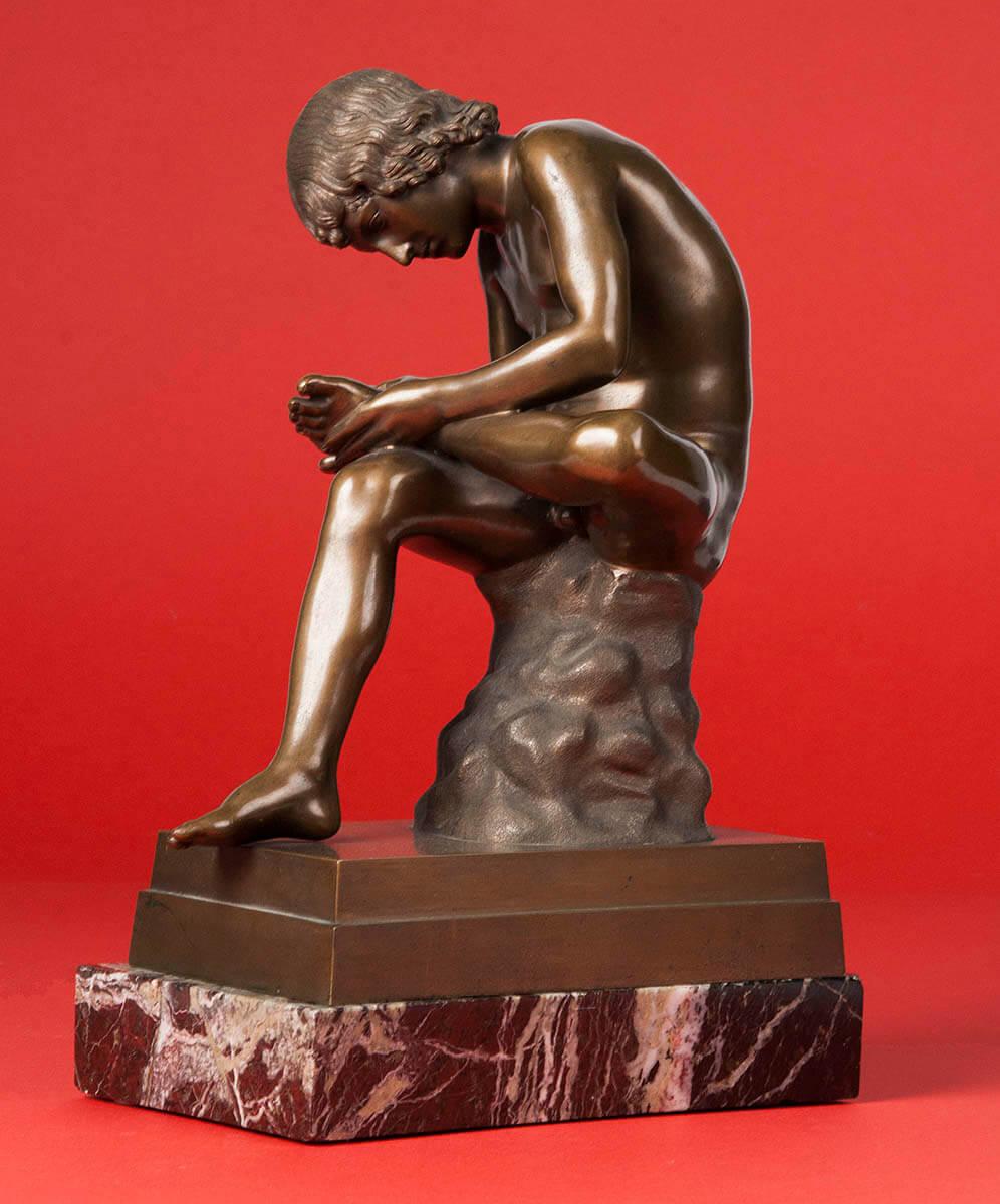 Classic bronze statue depicting a young boy picking a thorn from his foot. The original statue is called 'Spinario' and dates from the first century B.C.
This copy is from circa 1900, it is signed 'B. Boschetti Roma'. Bosschetti is a bronze caster