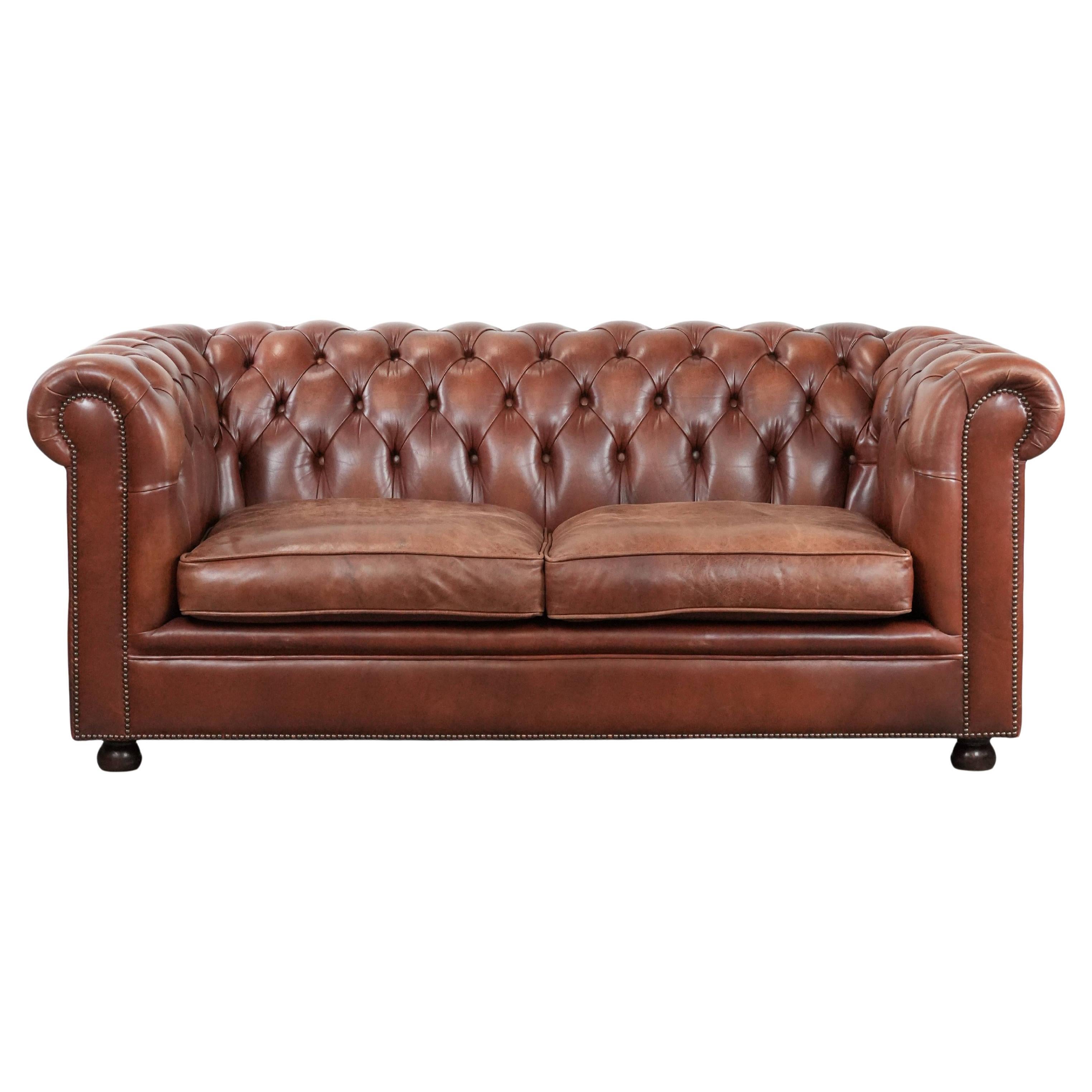 Classic brown cowhide leather Chesterfield sofa in English style