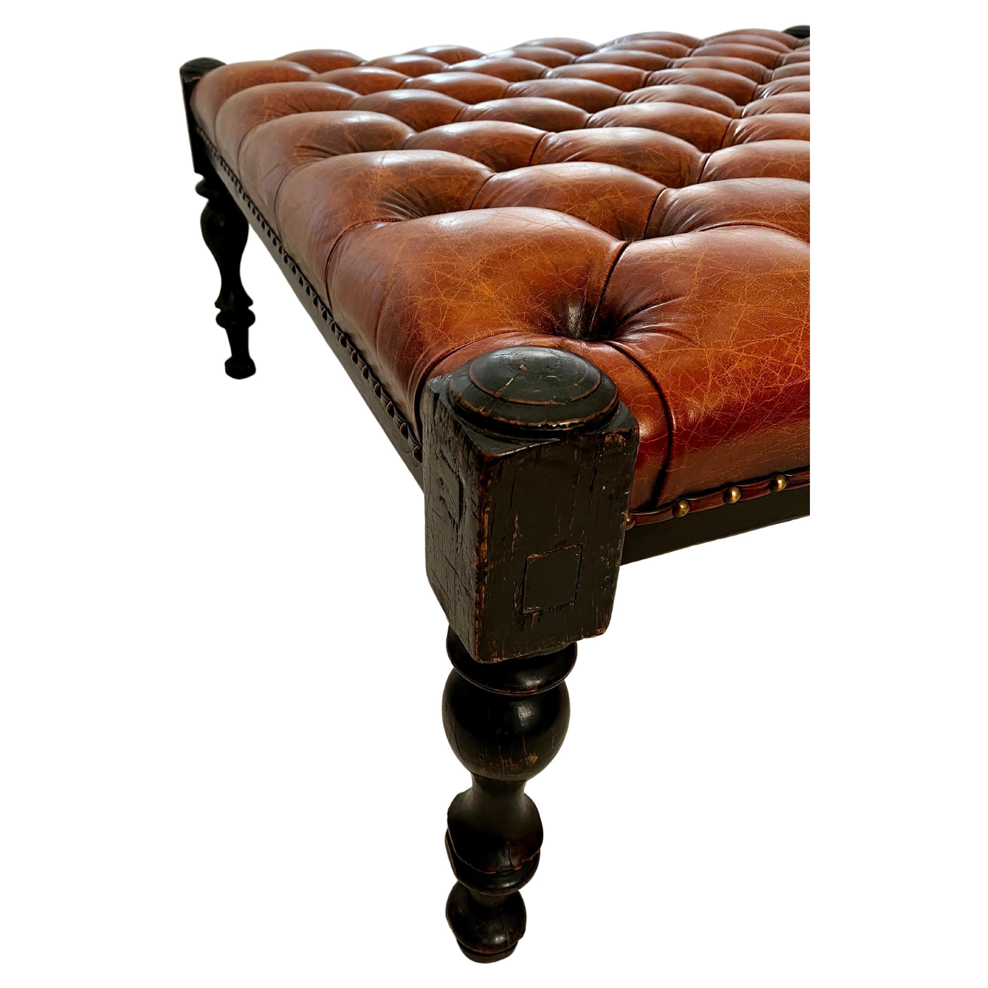 Classic Leather Tufted Ottoman in the style of Ralph Lauren. 