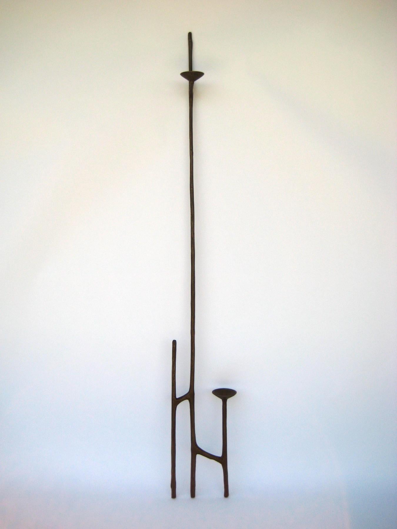 Classic brown patina bronze leaning candlestick by Mary Brogger
Dimensions: W 33 cm x D 5 cm x H 196 cm.
Materials: brown patinated bronze.
Also available in other finishes and dimensions. Please contact us.

Mary Brogger is an internationally